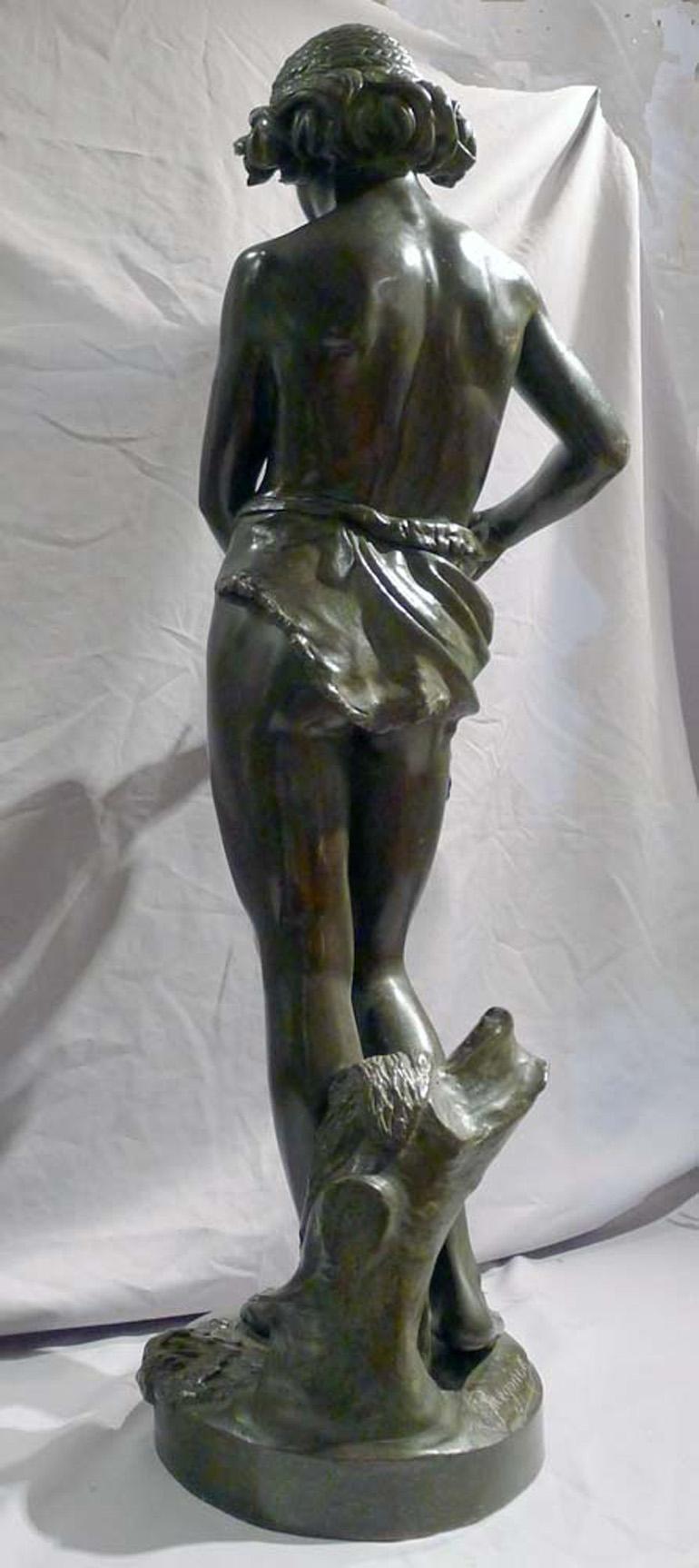Late 19th Century Patinated bronze sculpture of young boy trimming the wings of a dove by Gregoire For Sale