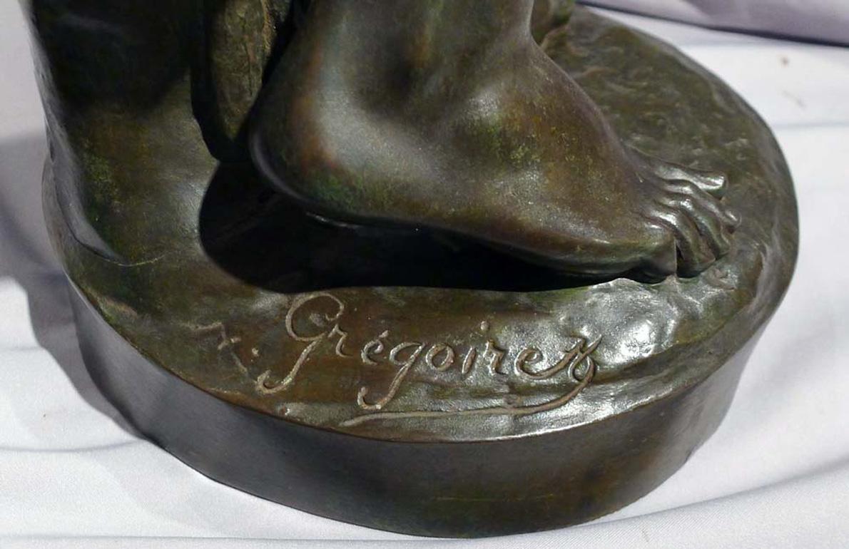 Bronze Patinated bronze sculpture of young boy trimming the wings of a dove by Gregoire For Sale