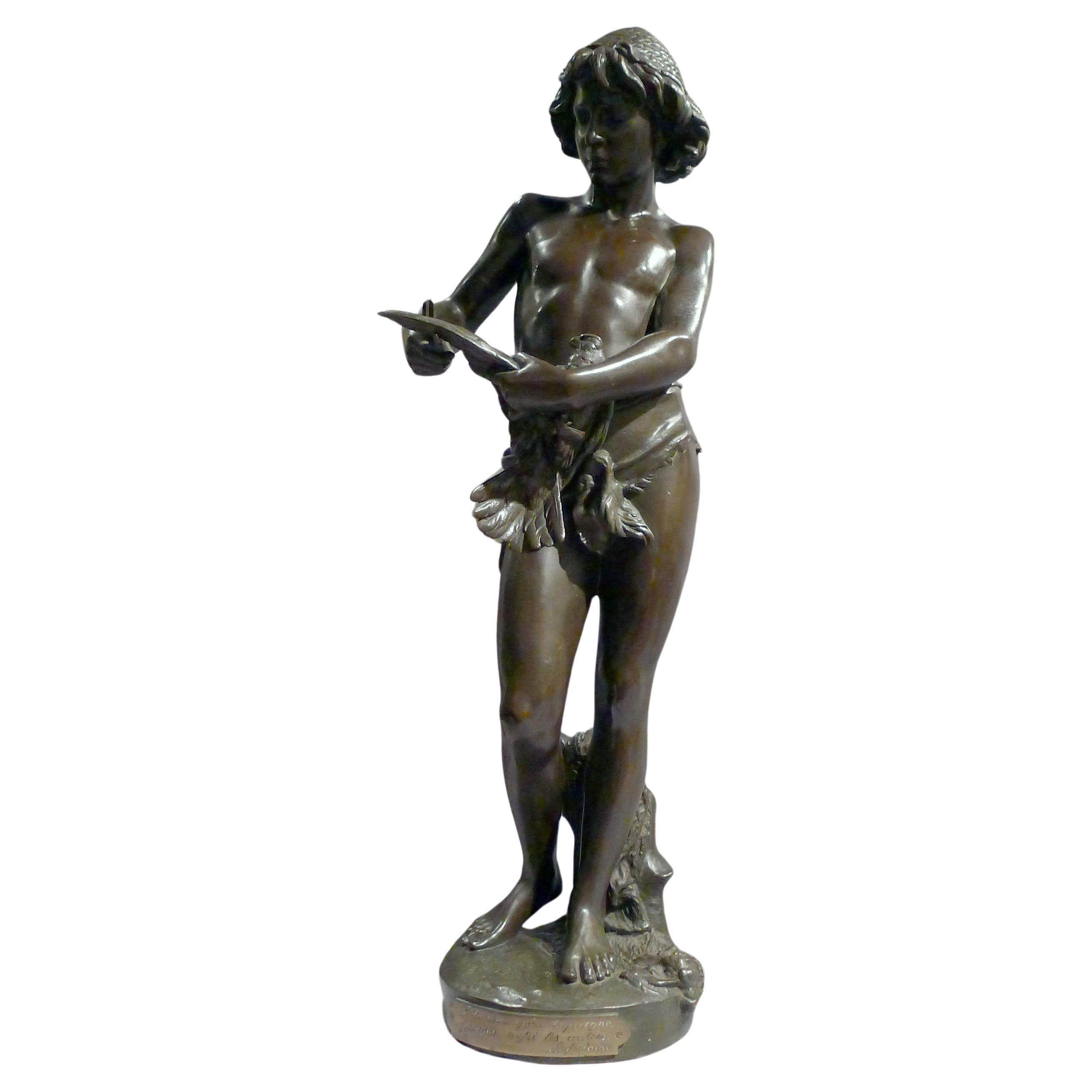 Patinated bronze sculpture of young boy trimming the wings of a dove by Gregoire