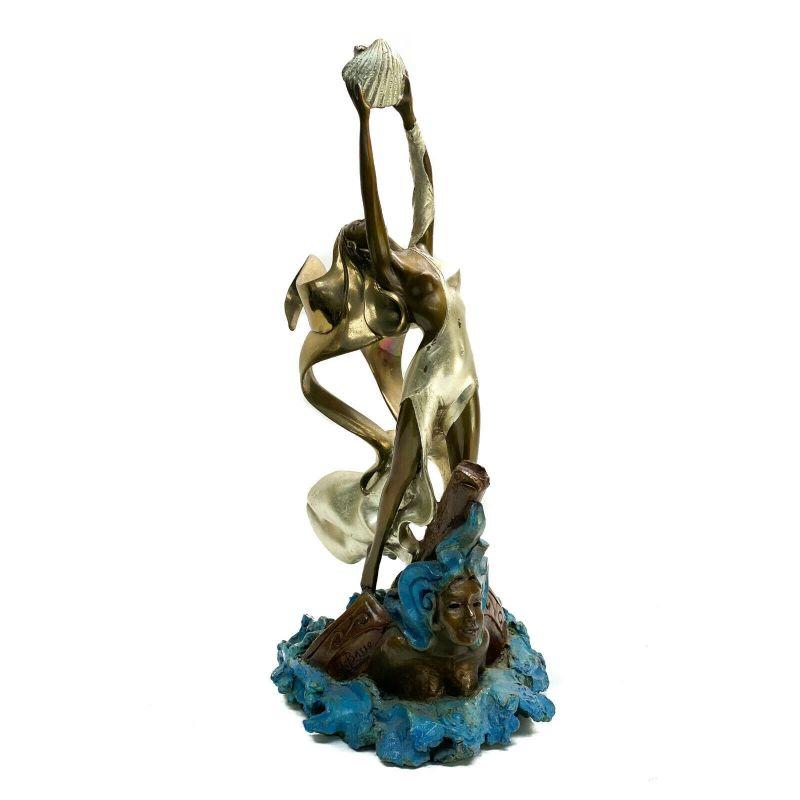 Patinated bronze sculpture- woman with shell by Angelo Basso

Angelo Basso (Italian 20th Century) patinated bronze sculpture- Woman with Shell. The sculpture depicts a partially nude beauty in gold flowing garbs standing on a sinking ship in the