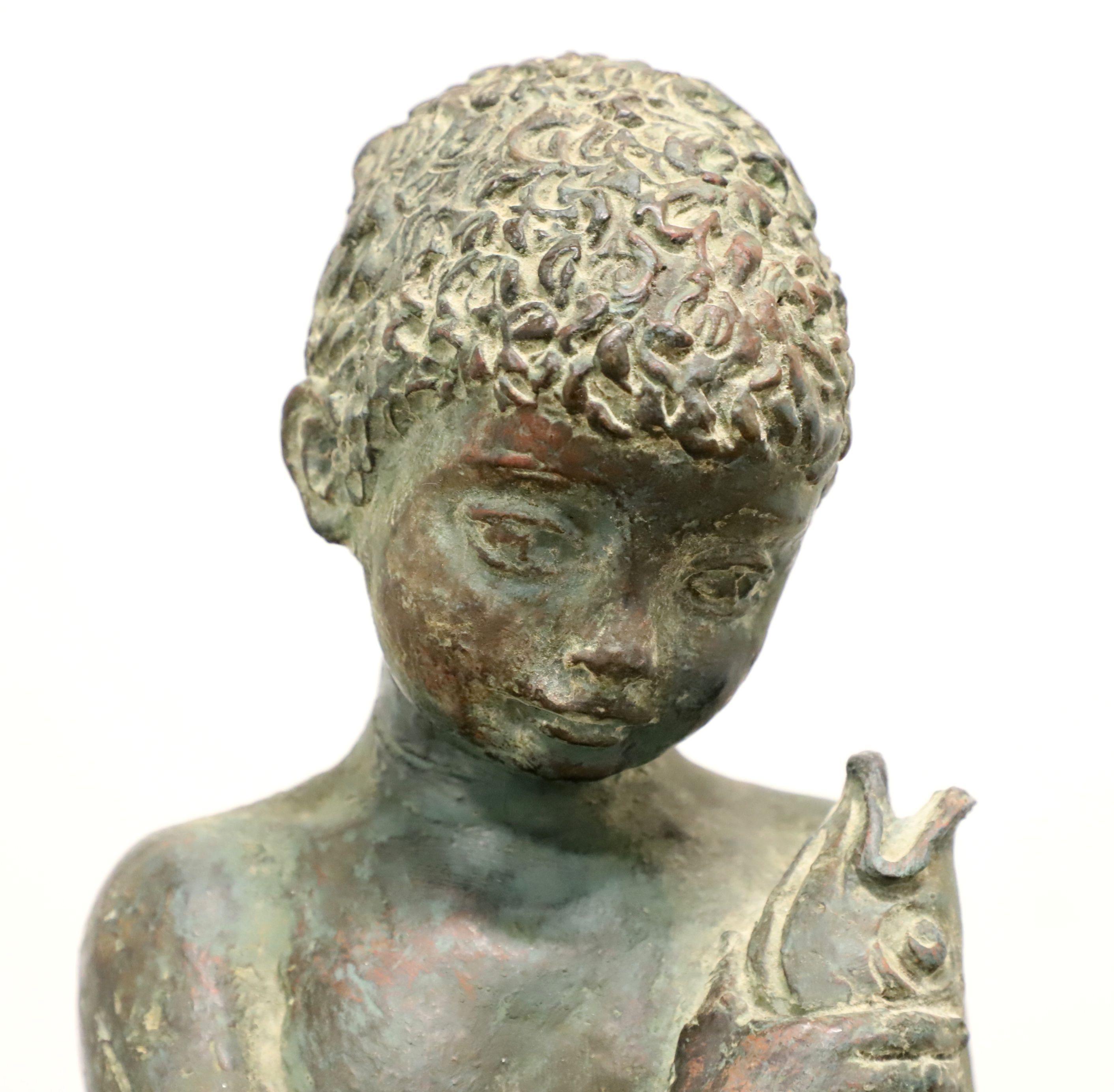 Patinated Bronze Seated Boy Holding Fish Sculpture In Good Condition In Charlotte, NC