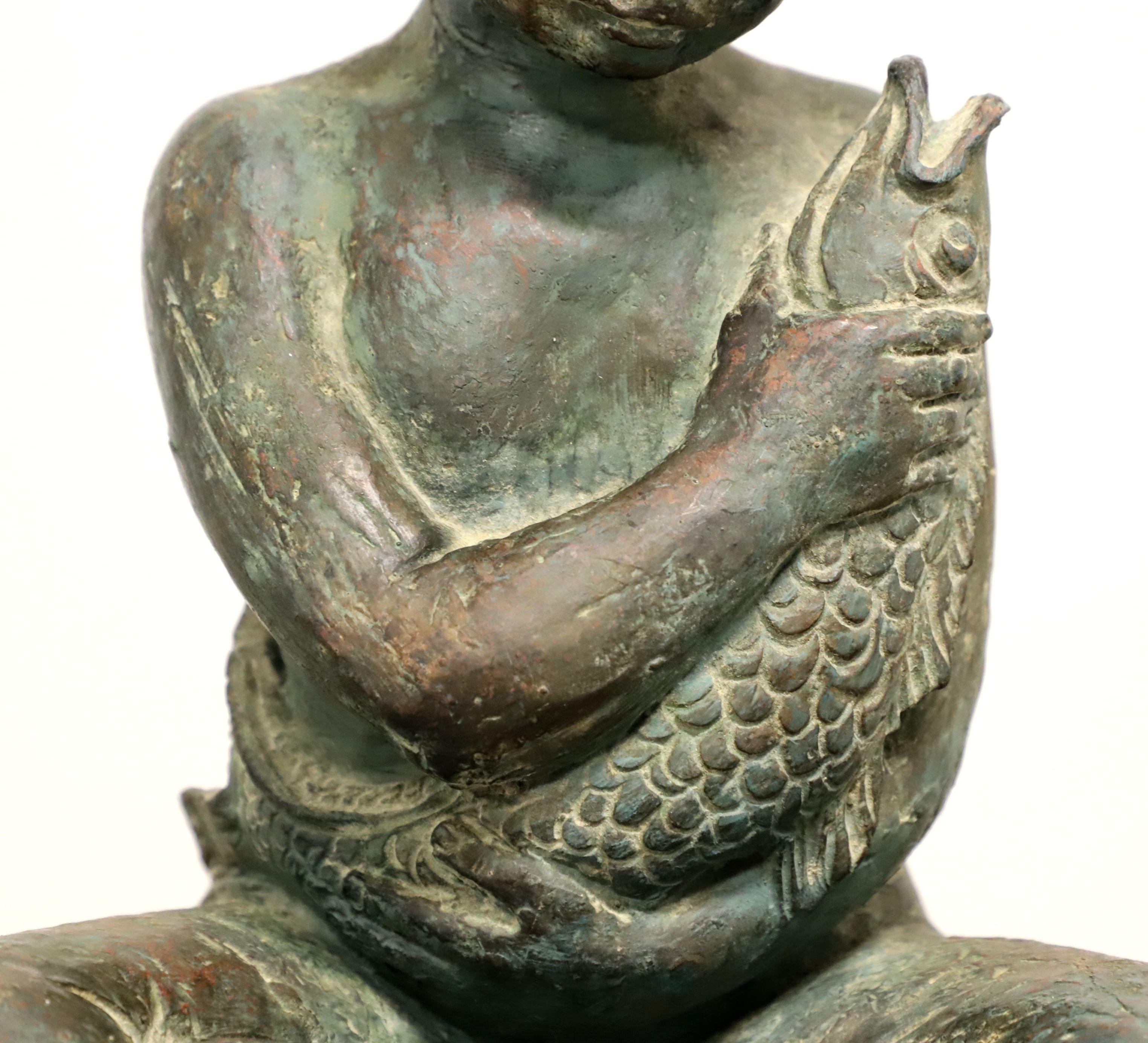 20th Century Patinated Bronze Seated Boy Holding Fish Sculpture
