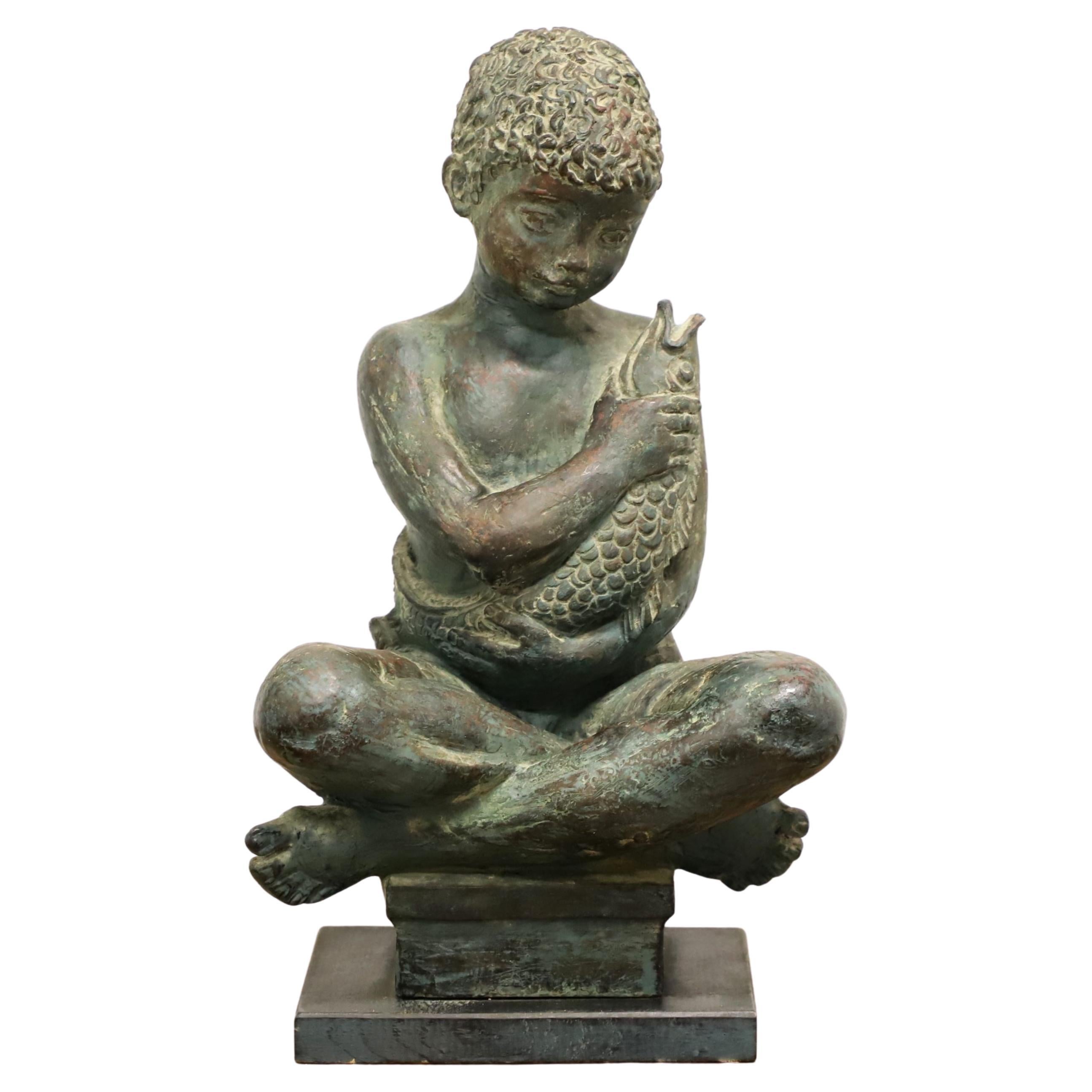 Patinated Bronze Seated Boy Holding Fish Sculpture