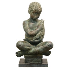 Patinated Bronze Seated Boy Holding Fish Sculpture
