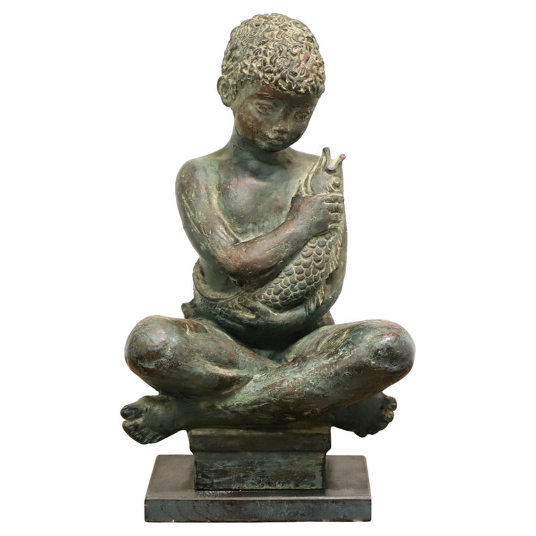 Patinated Bronze Seated Boy Holding Fish Sculpture For Sale at 1stDibs