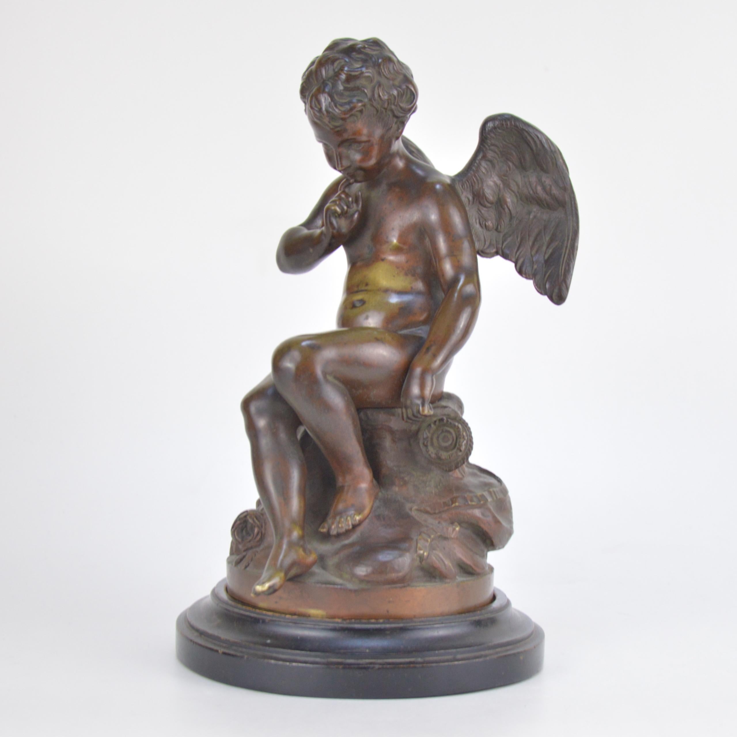 Patinated bronze statue representing Amour. French school, 19th century. Wooden base.
Measures: Height 27 cm.