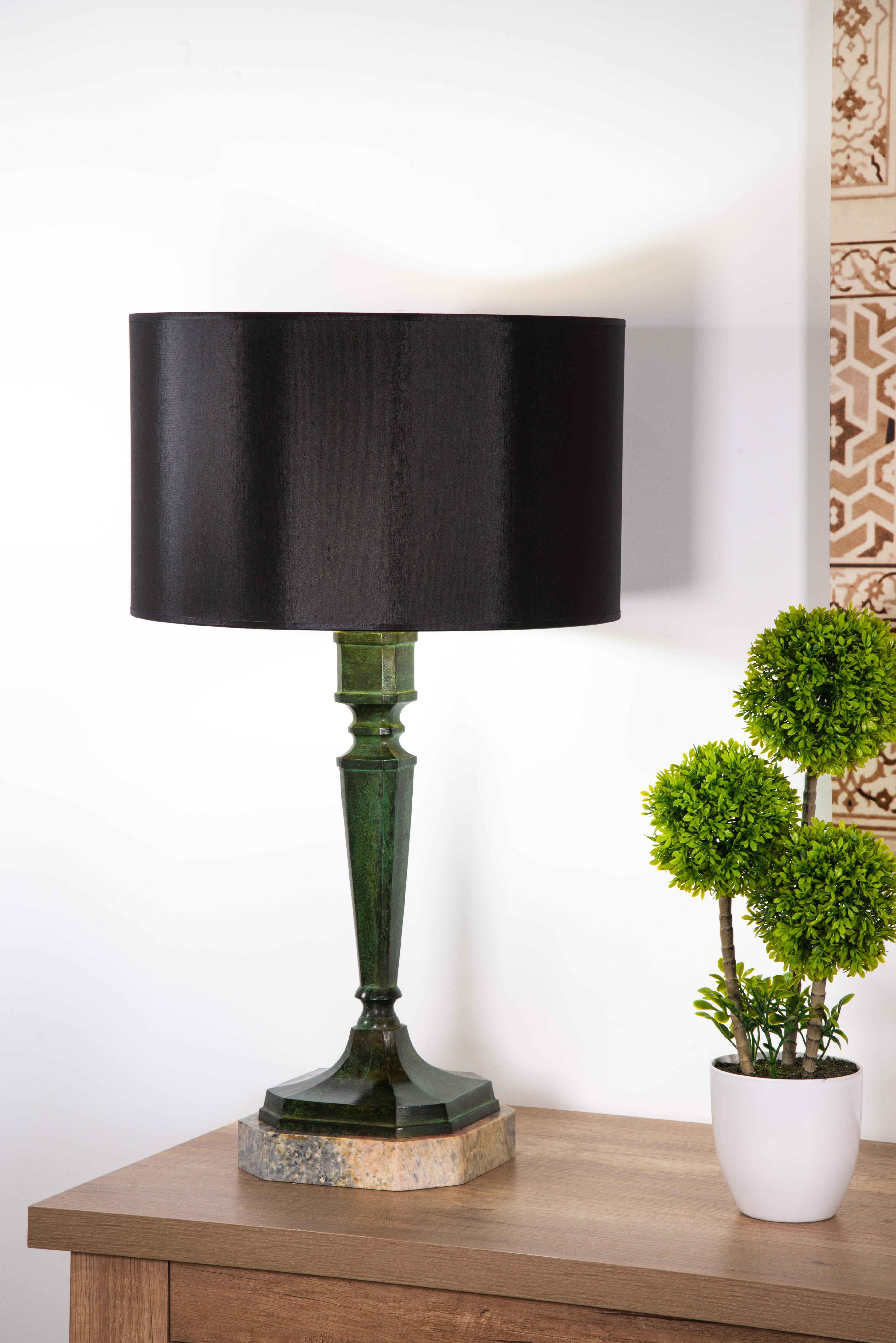 Bronze Patinated bronze table lamp in the shape of a stipe. For Sale