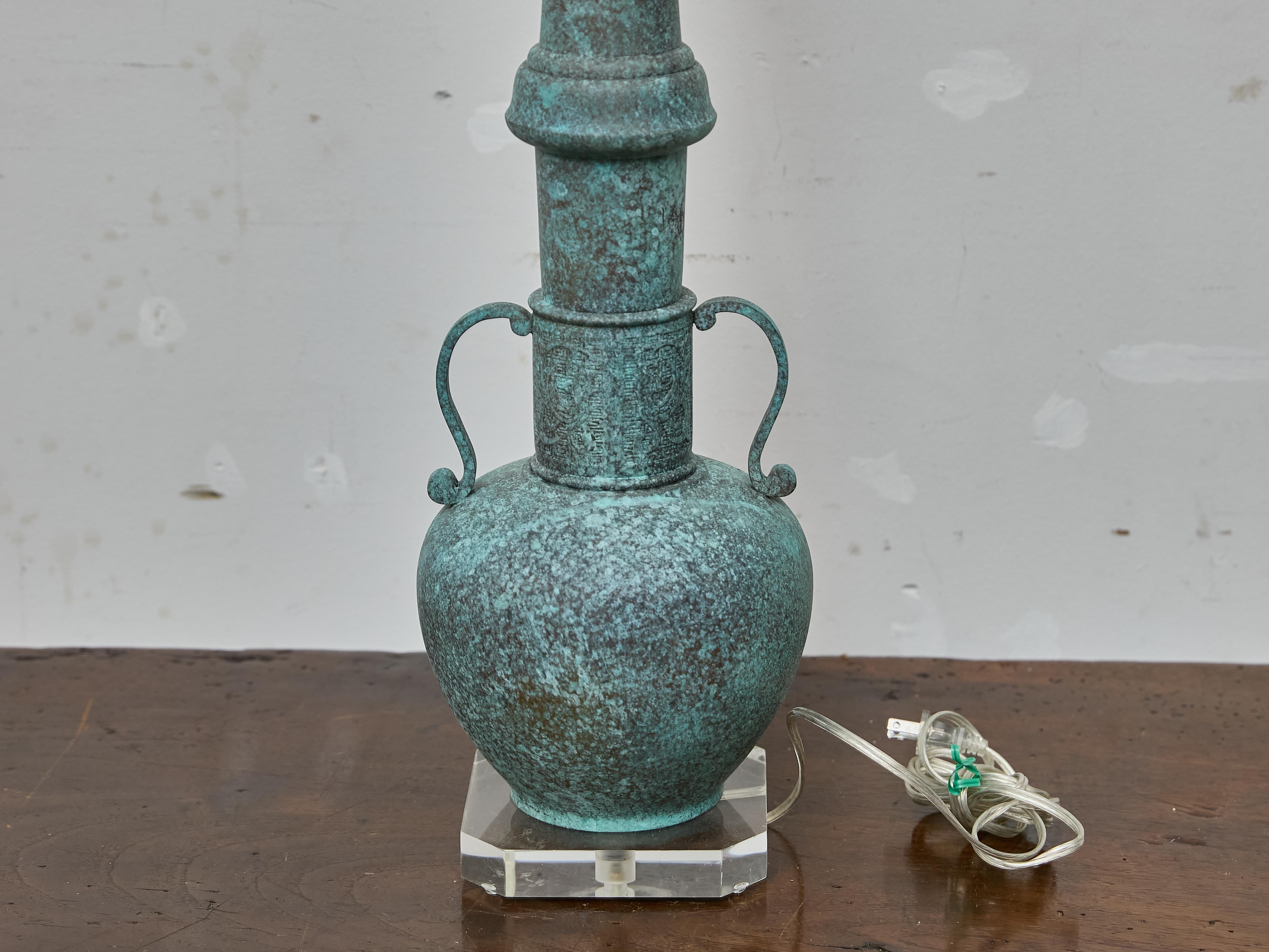 American Patinated Bronze Table Lamp in the Style of James Mont on Lucite Base For Sale
