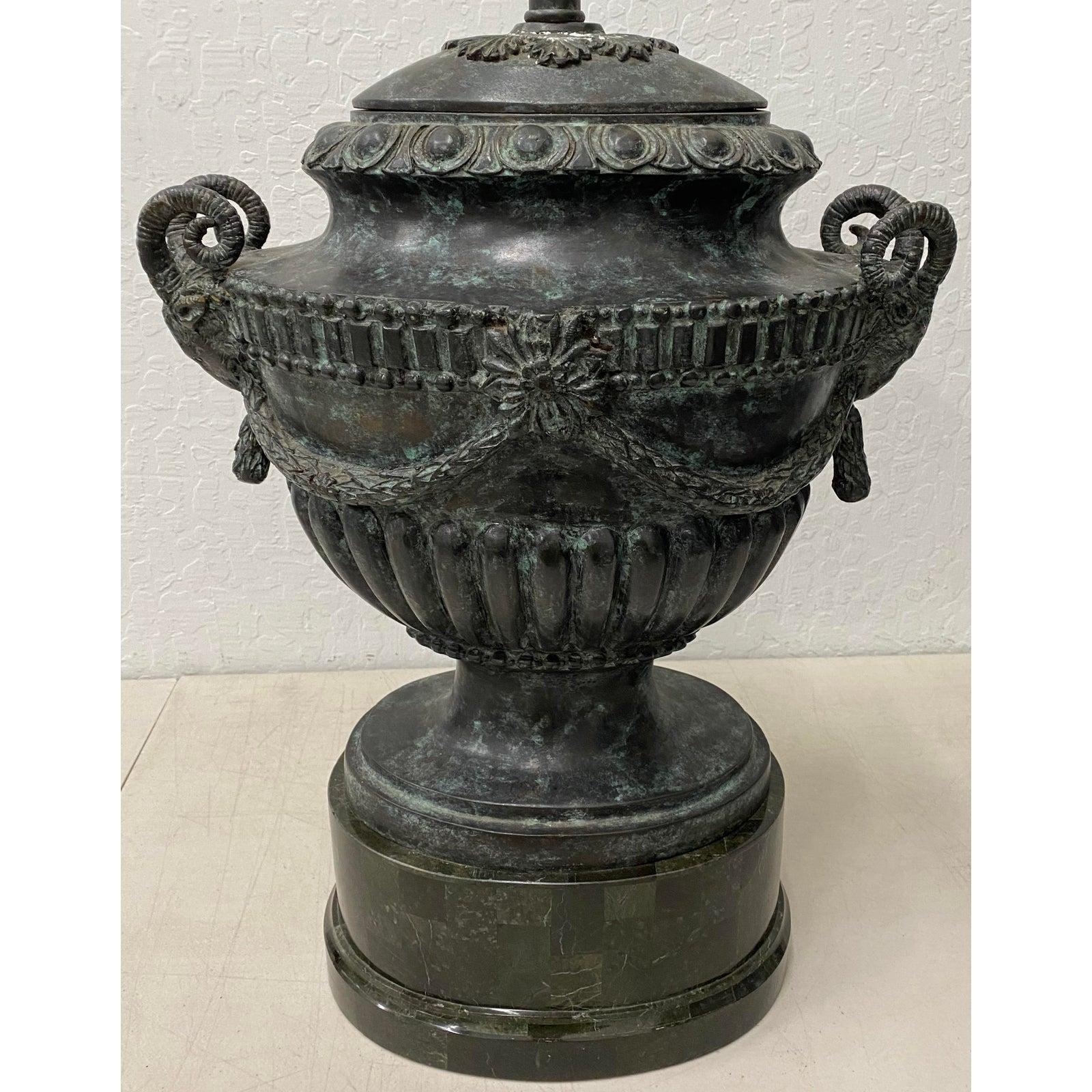Patinated cast bronze urn table lamp by Maitland Smith, circa 1960

Elegant cast bronze urn lamp with rams heads.

Measures: 11.75
