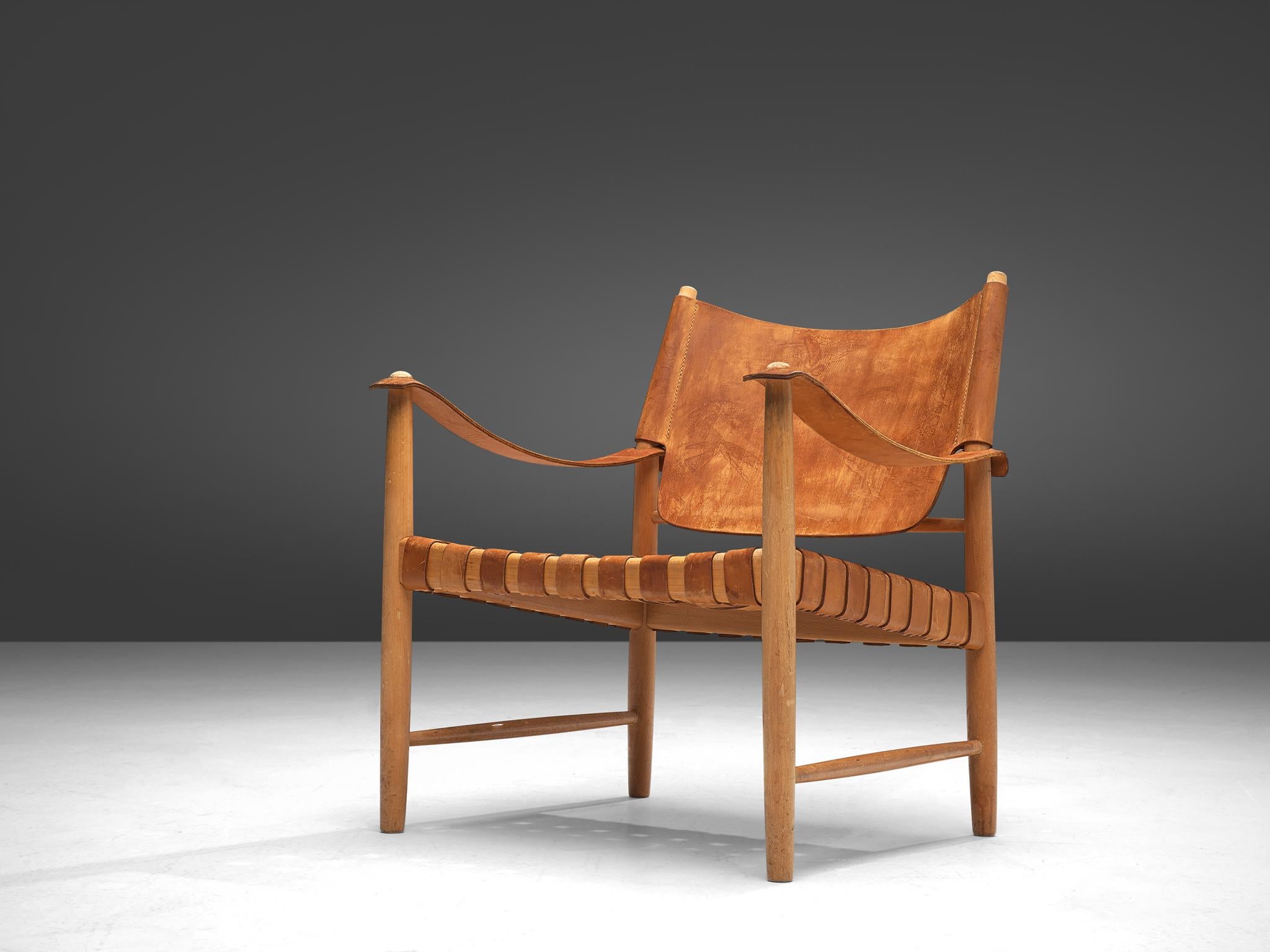 Scandinavian Modern Patinated Cognac Leather Safari Chair, Denmark, 1950s