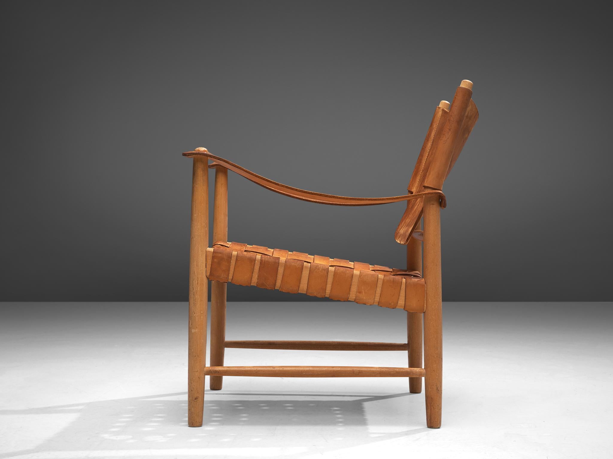 Danish Patinated Cognac Leather Safari Chair, Denmark, 1950s