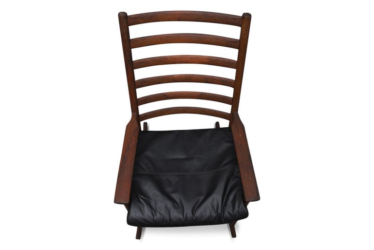 Mid-Century Modern Patinated Danish Modern Teak Highback Rocking Chair For Sale