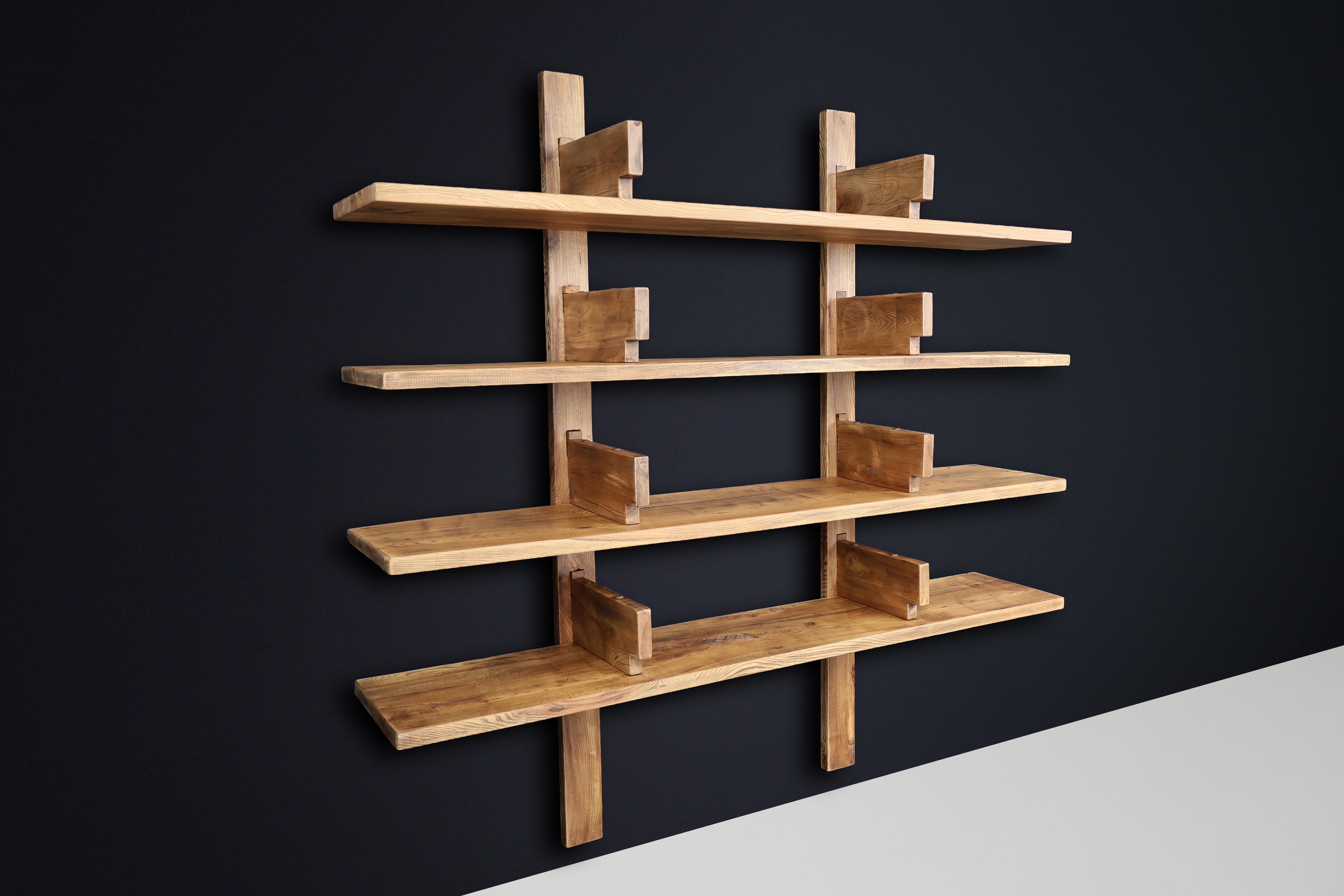 Patinated Elm Bookshelf in the Style of Pierre Chapo, France 1970s

A striking and robust wall-mounted bookshelf crafted in solid patinated elmwood, made in France in the 1970s in the style of Pierre Chapo. While not an original Chapo production,