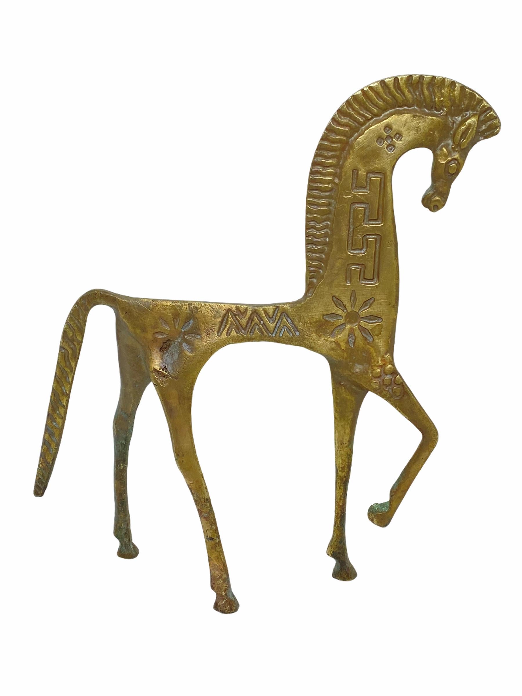 Offered is a Mid-Century Modern Pepe Mendoza style Etruscan patinated carved brass horse sculptures. This Etruscan brass horses is an iconic Mid-Century Modern item of decor with carved Mid-Century Modern details. It would look fabulous on a console