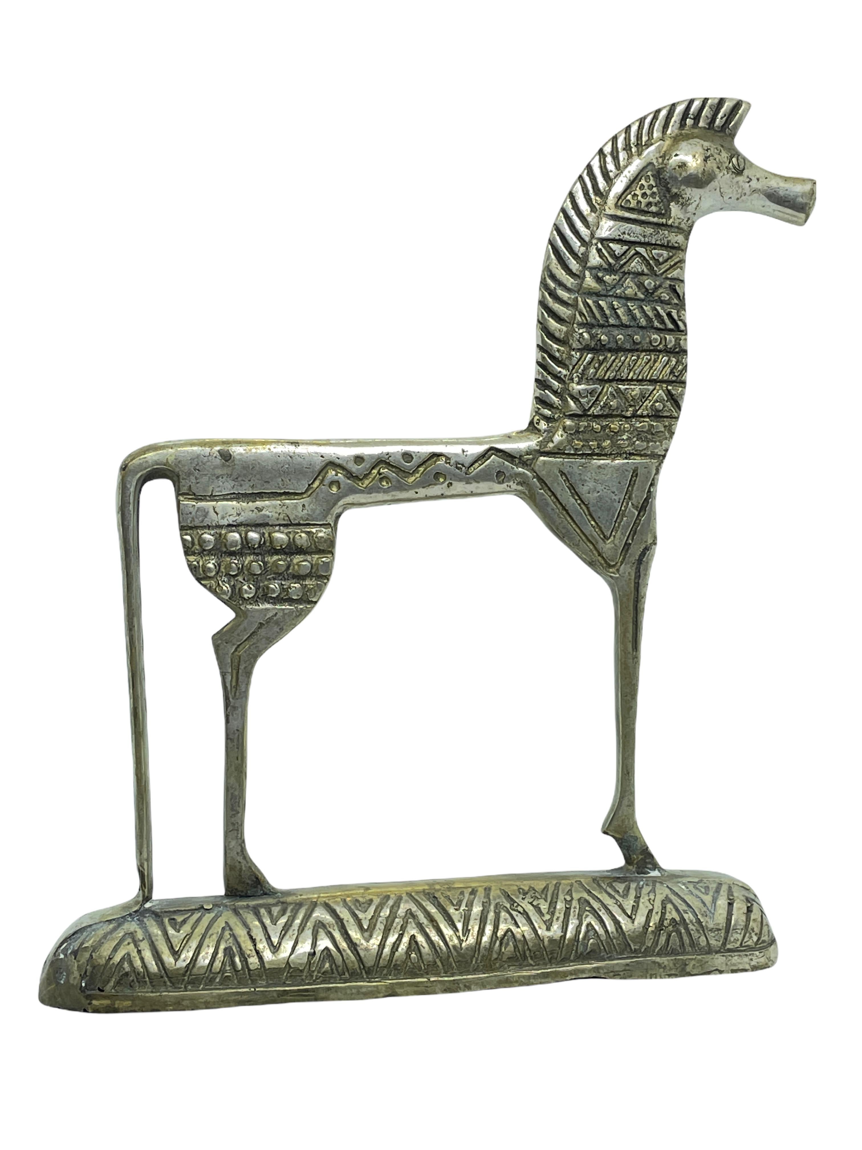 This is a bronze sculpture, which may have been done by Frederic Weinberg.
It is an incredibly stylized Etruscan horse sculpture and has a patina finish. Italian-made and great for any Mid-Century Modern interior.
It looks like the work of Frederic