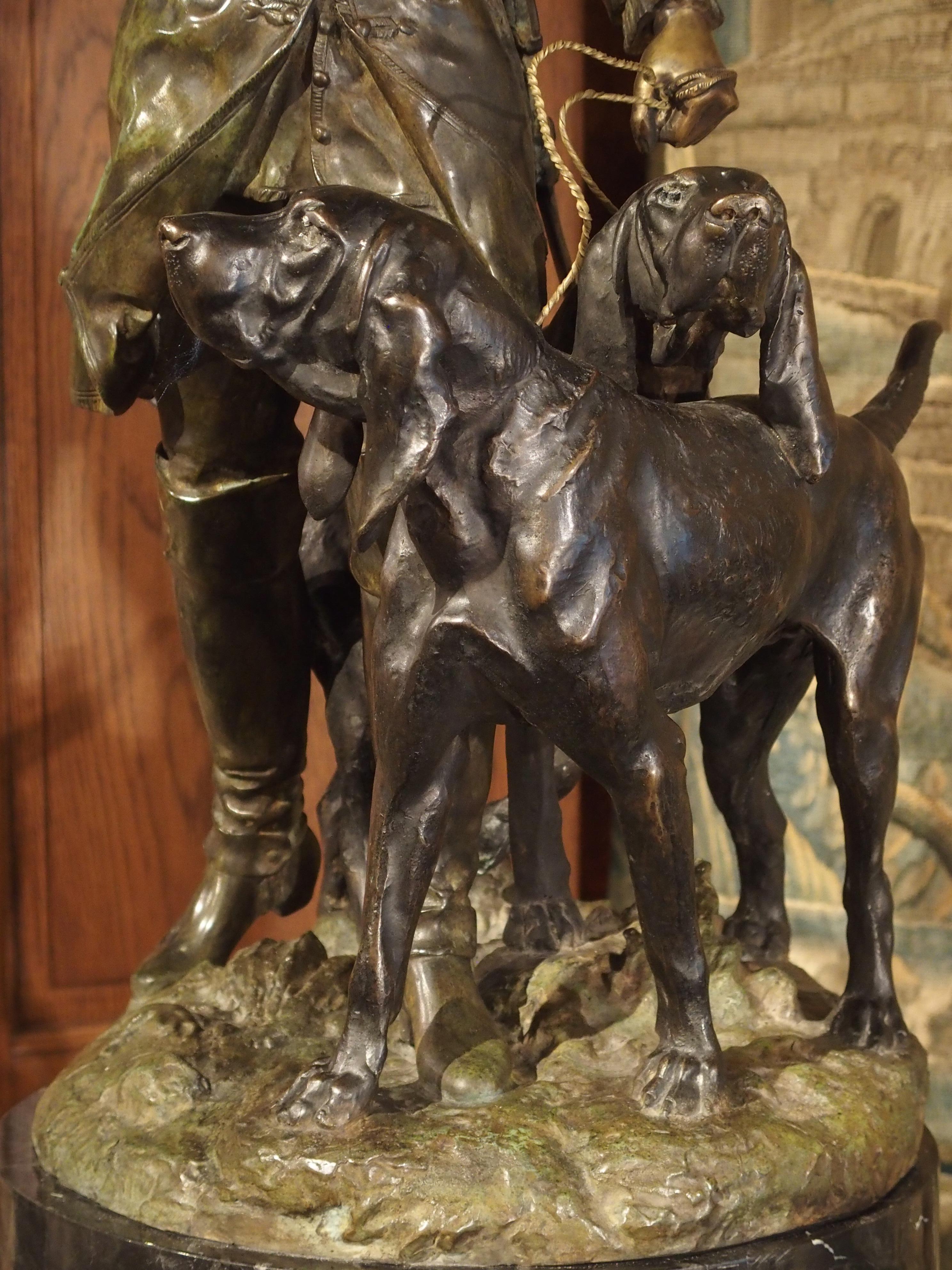 Carved Patinated French Bronze Statue of Hunter and Hounds on Marble Pedestal