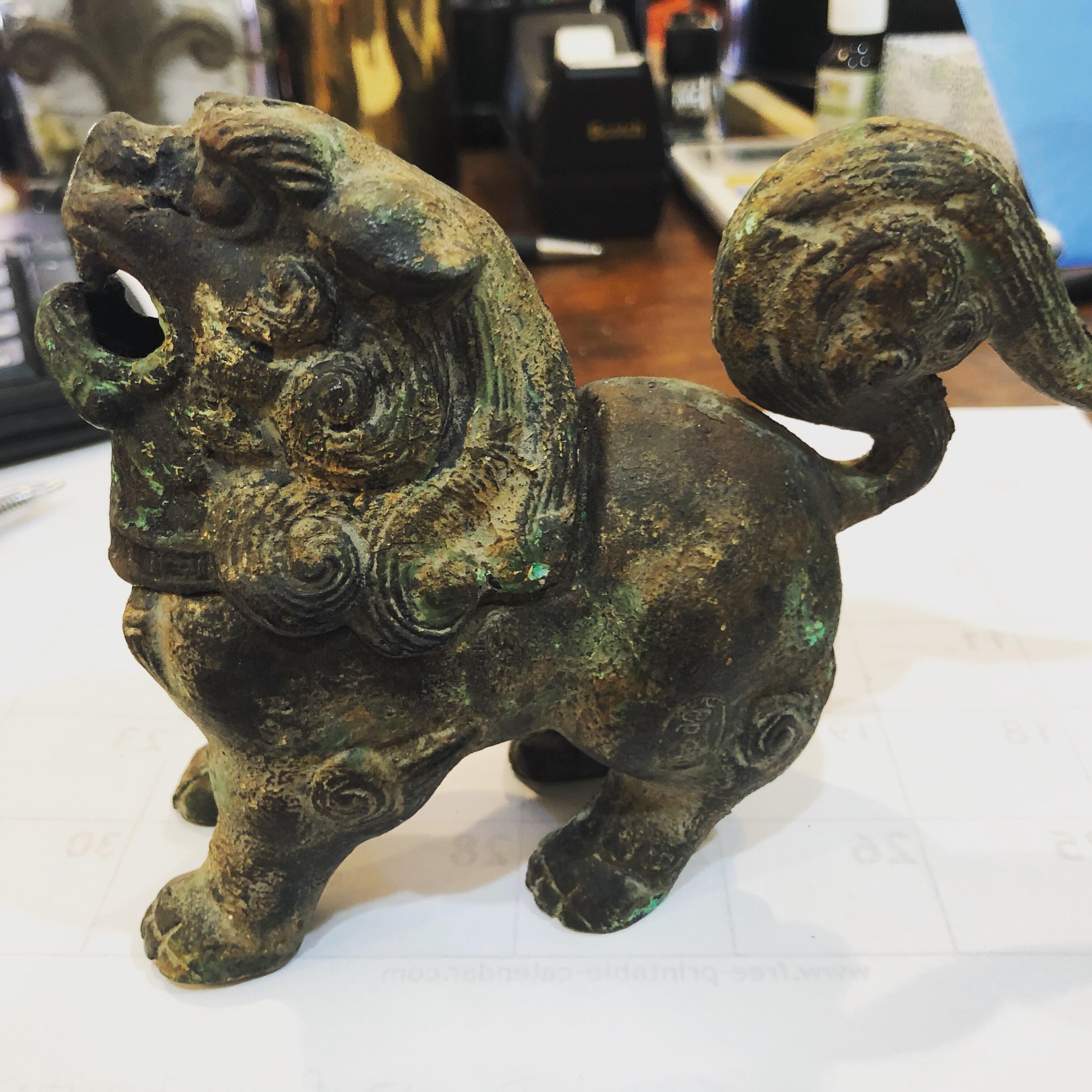 Patinated Iron Foo Dog or Lion Sensor possibly signed . See photos. Perfect for incense. His head comes off to hold the incense. Nice patinated finish. This will parcel ship for $45