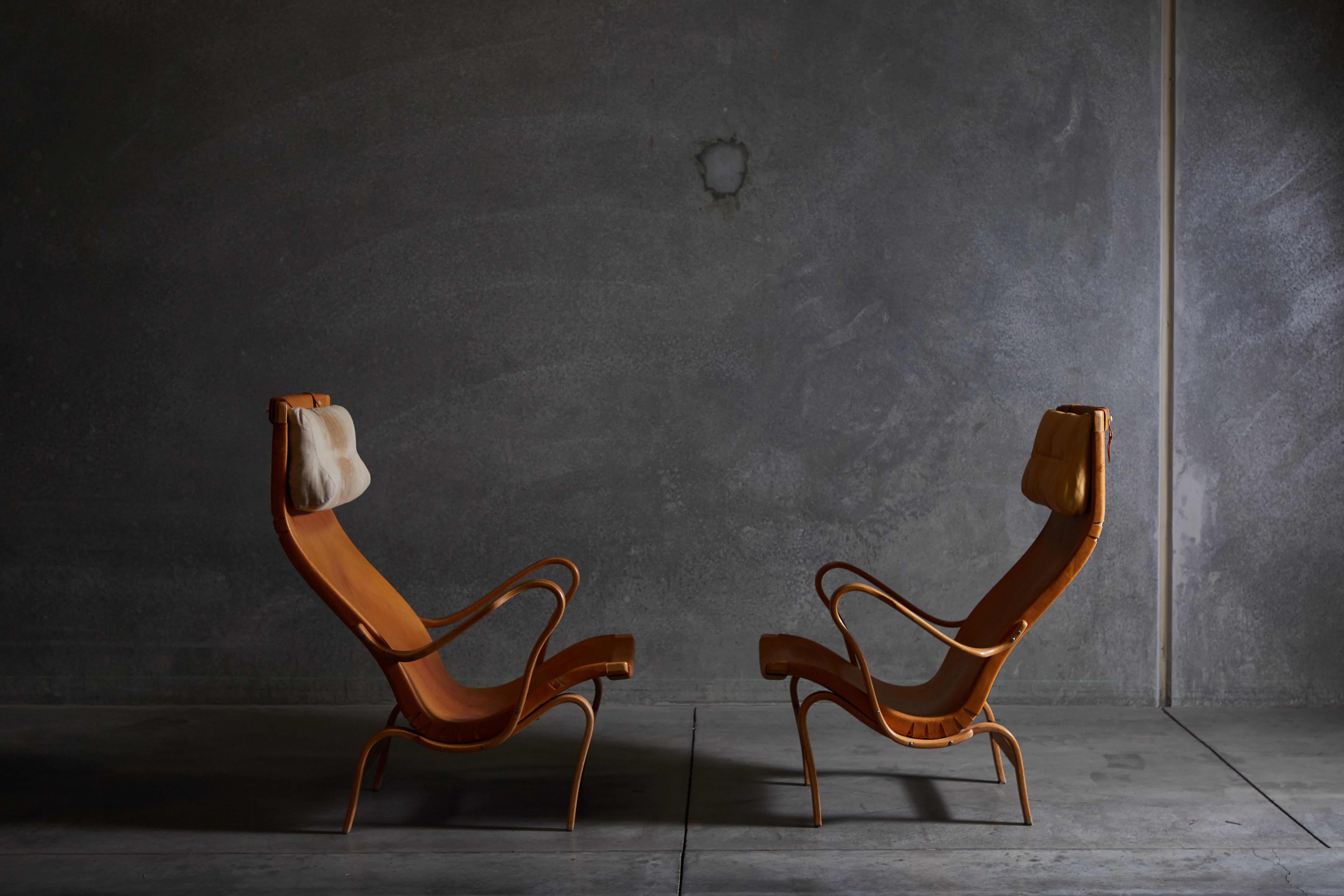 Patinated Leather Pernilla Lounge Chairs by Bruno Mathsson In Distressed Condition In Los Angeles, CA