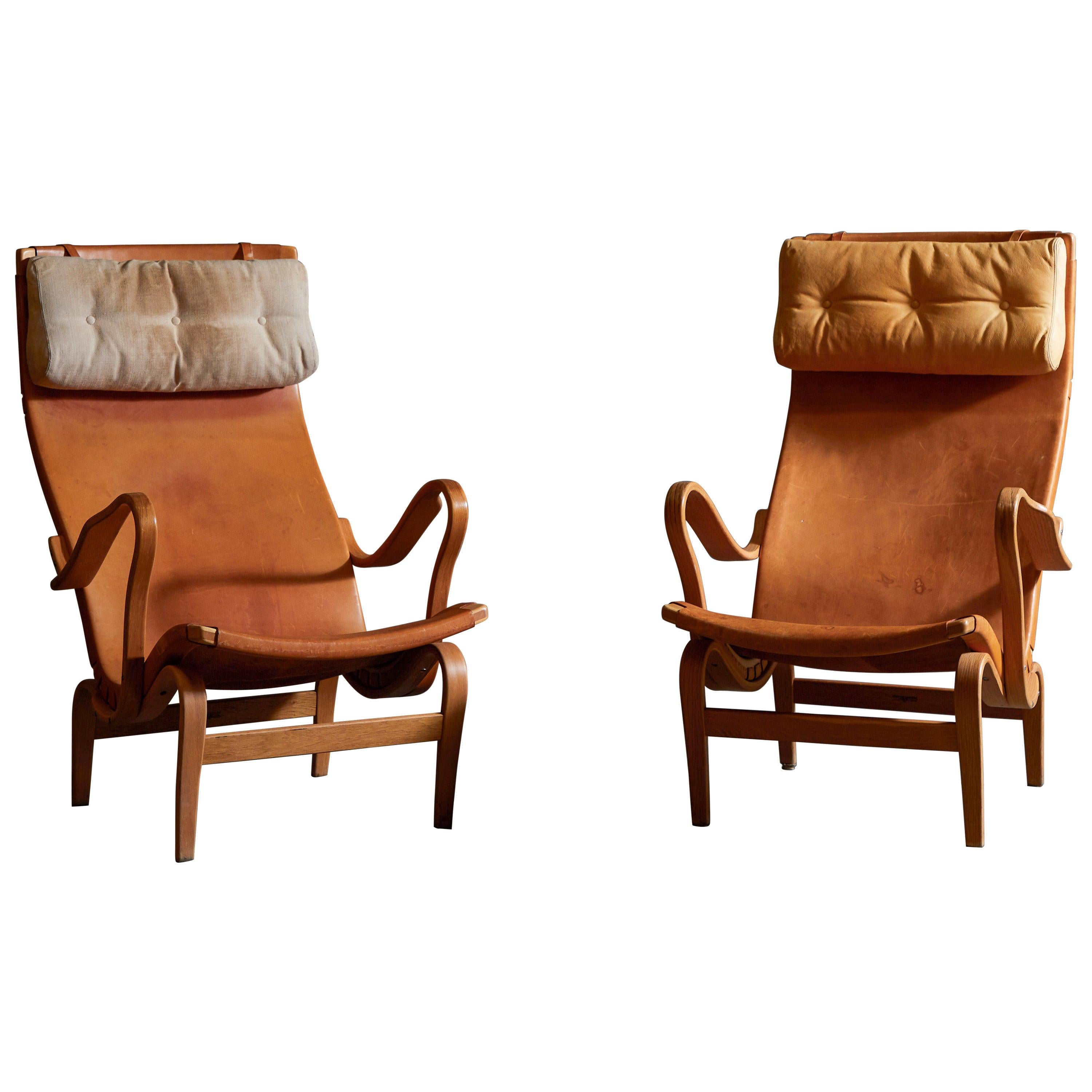 Patinated Leather Pernilla Lounge Chairs by Bruno Mathsson