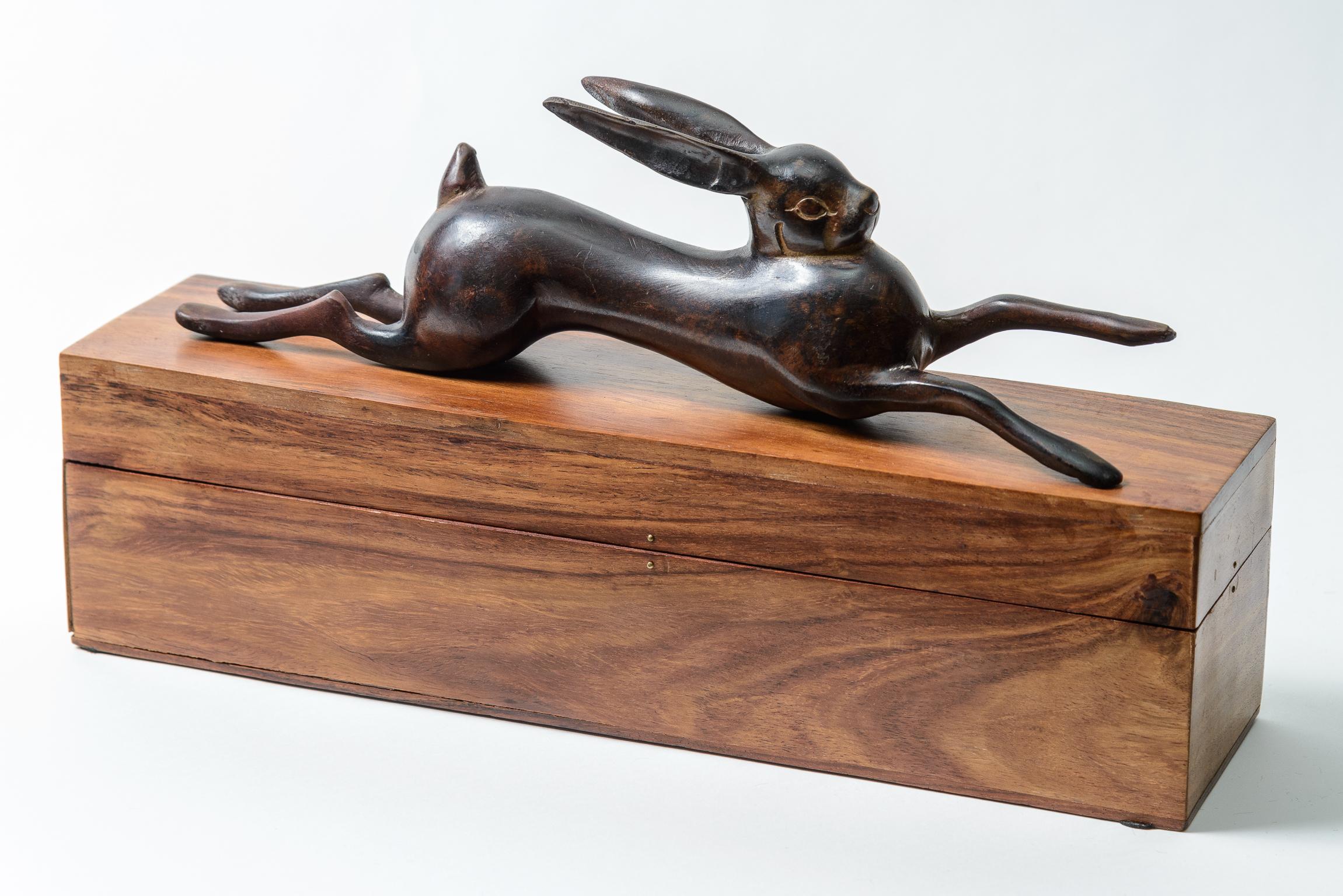 Patinated Metal and rosewood bunny box.
A well made whimsical table top accessory 