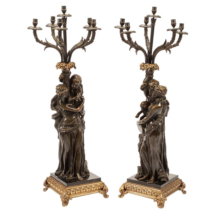 Patinated Neoclassical Figural Candelabra After Claude Michel, aka Clodion For Sale