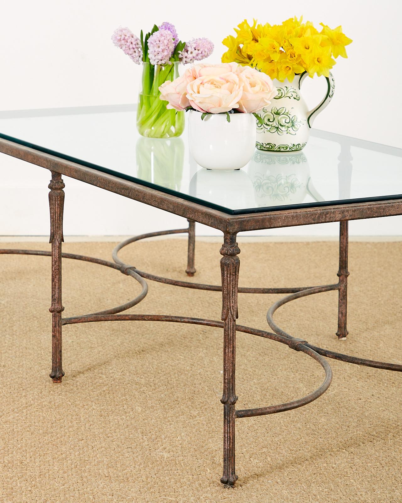 Splendid bronze cocktail or coffee table featuring a patinated metal finish with an aged patina. Crafted in the neoclassical taste in the style and manner of Maison Jansen. Constructed with a steel frame supported by beautifully cast bronze legs.