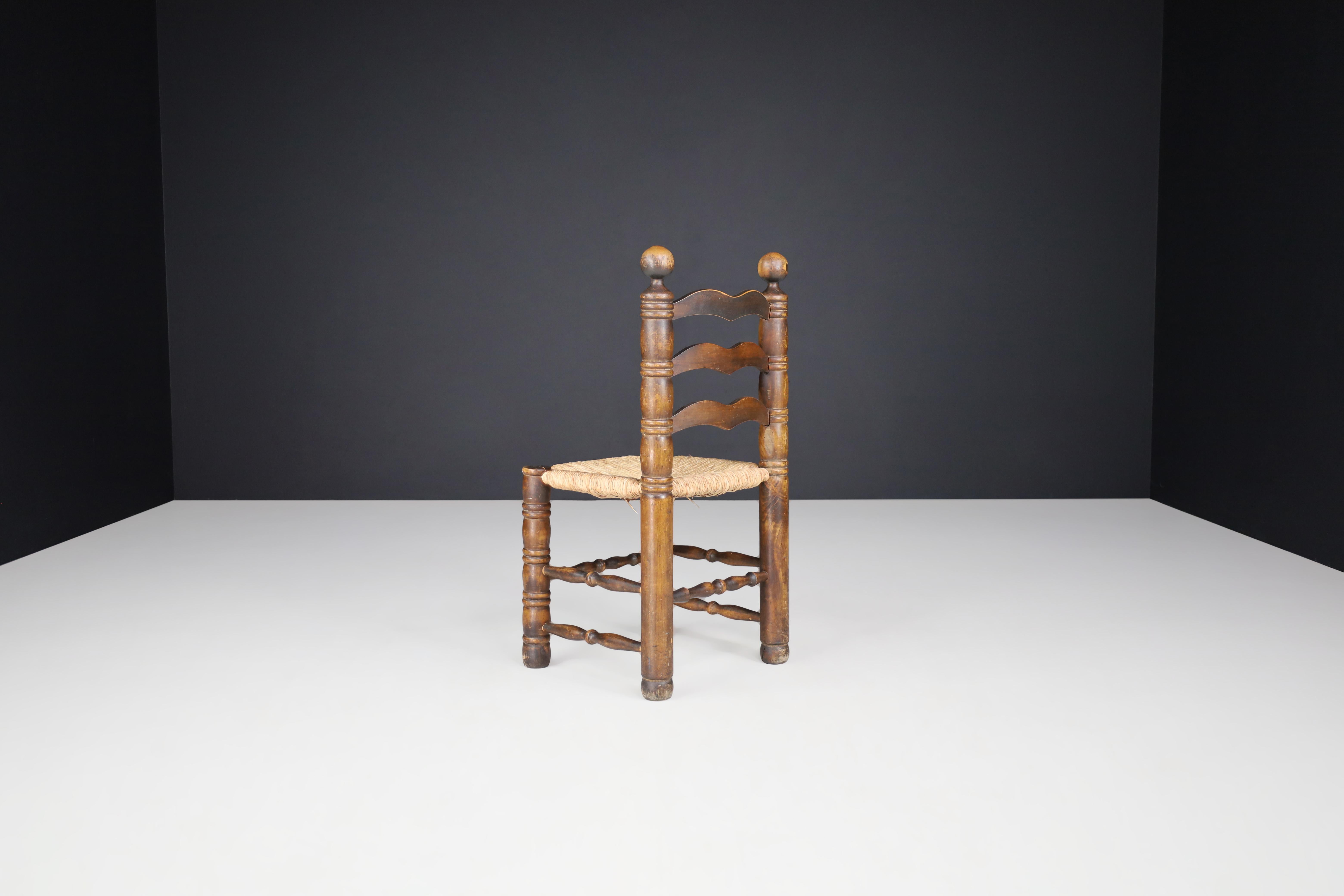 French Patinated Oak and Rush Turned Chairs by Charles Dudouyt, France, 1940s For Sale