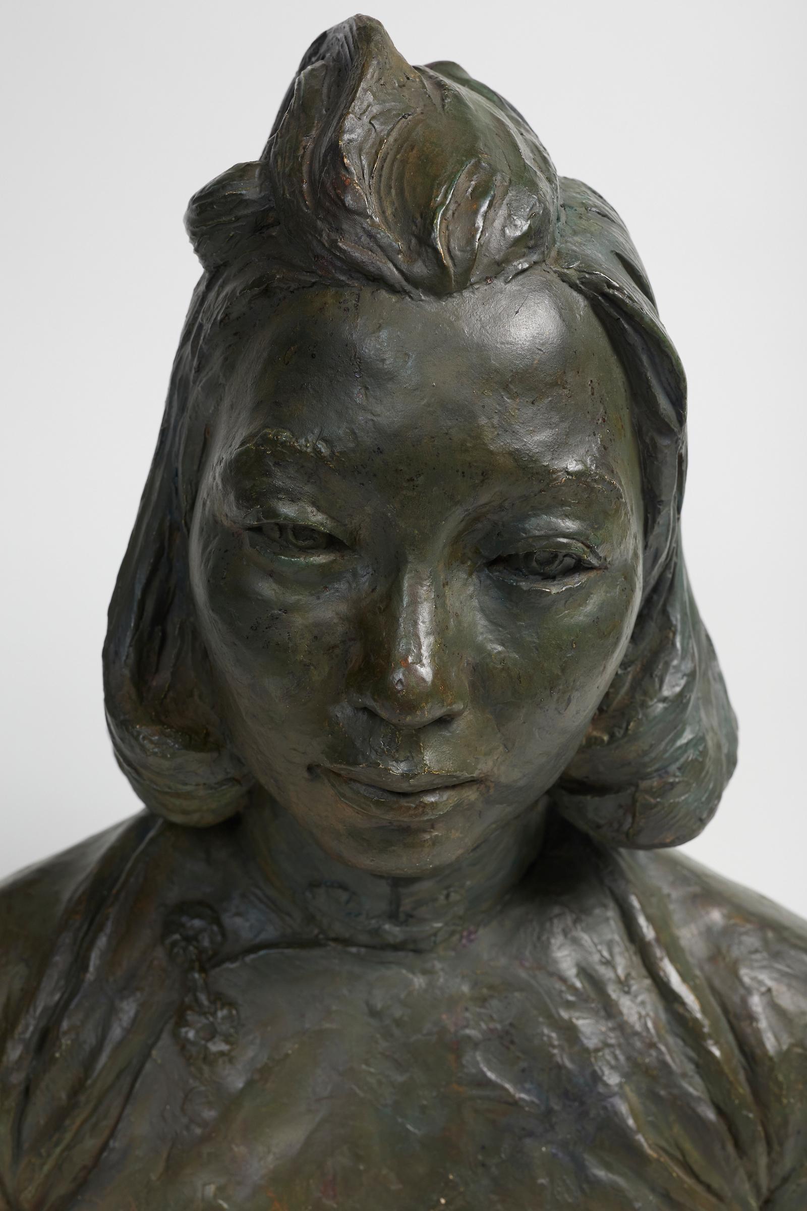 Patinated plaster bust of an Asian woman by Herbert McRae Miller.
