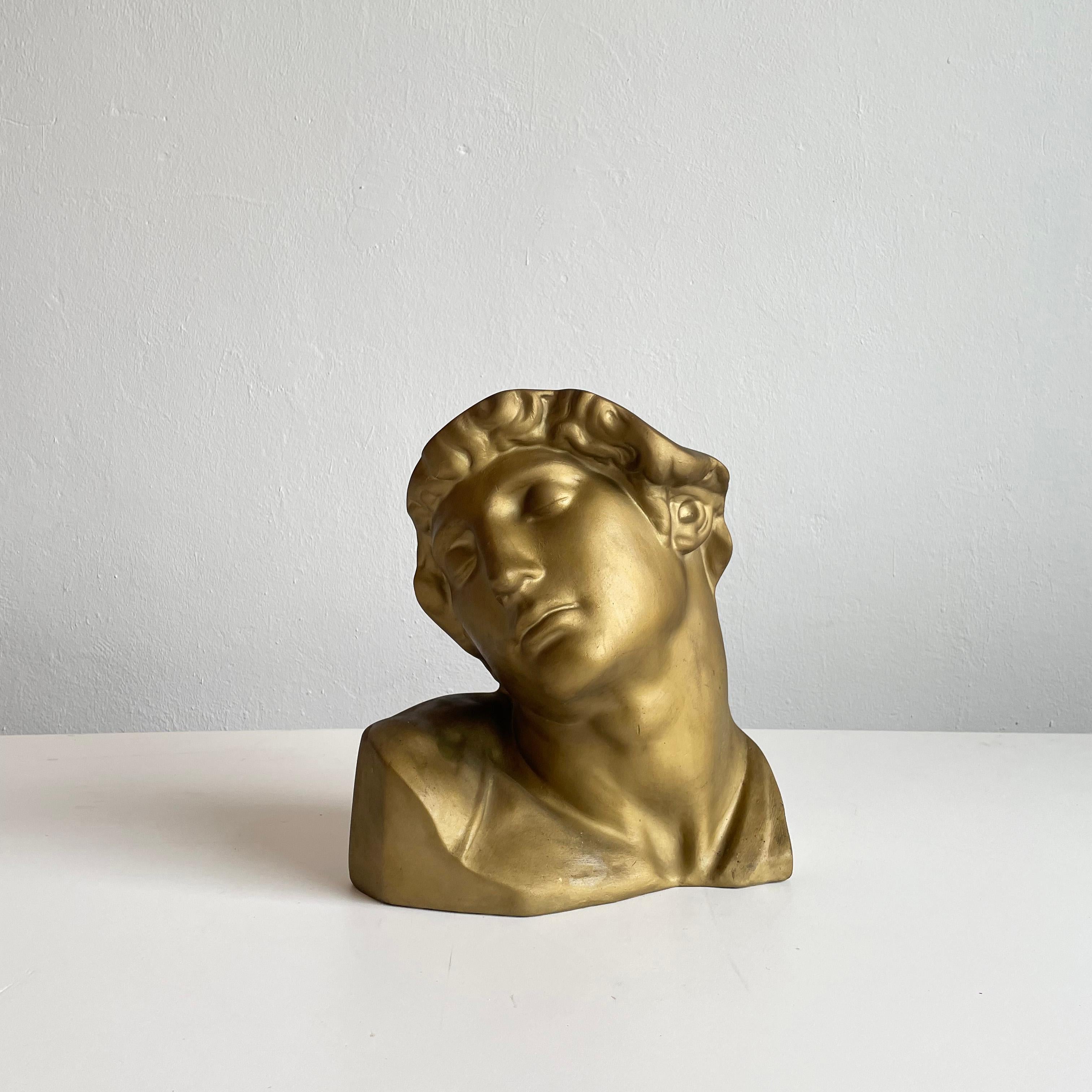 Gold patinated bust of a Dying Slave, after the renaissance work by Michelangelo, impressed 