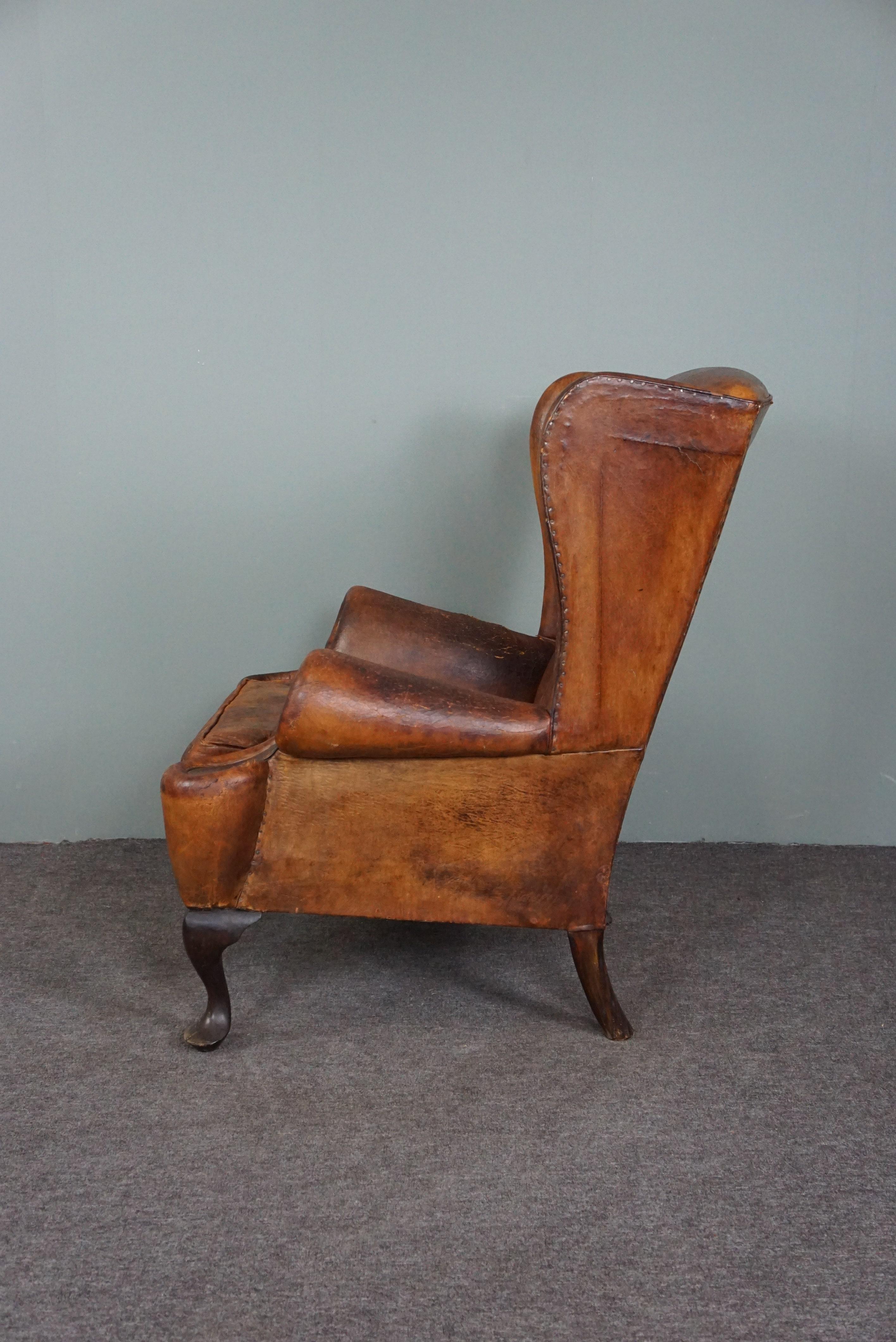 Hand-Crafted Patinated sheepskin antique Wingback wingback armchair For Sale