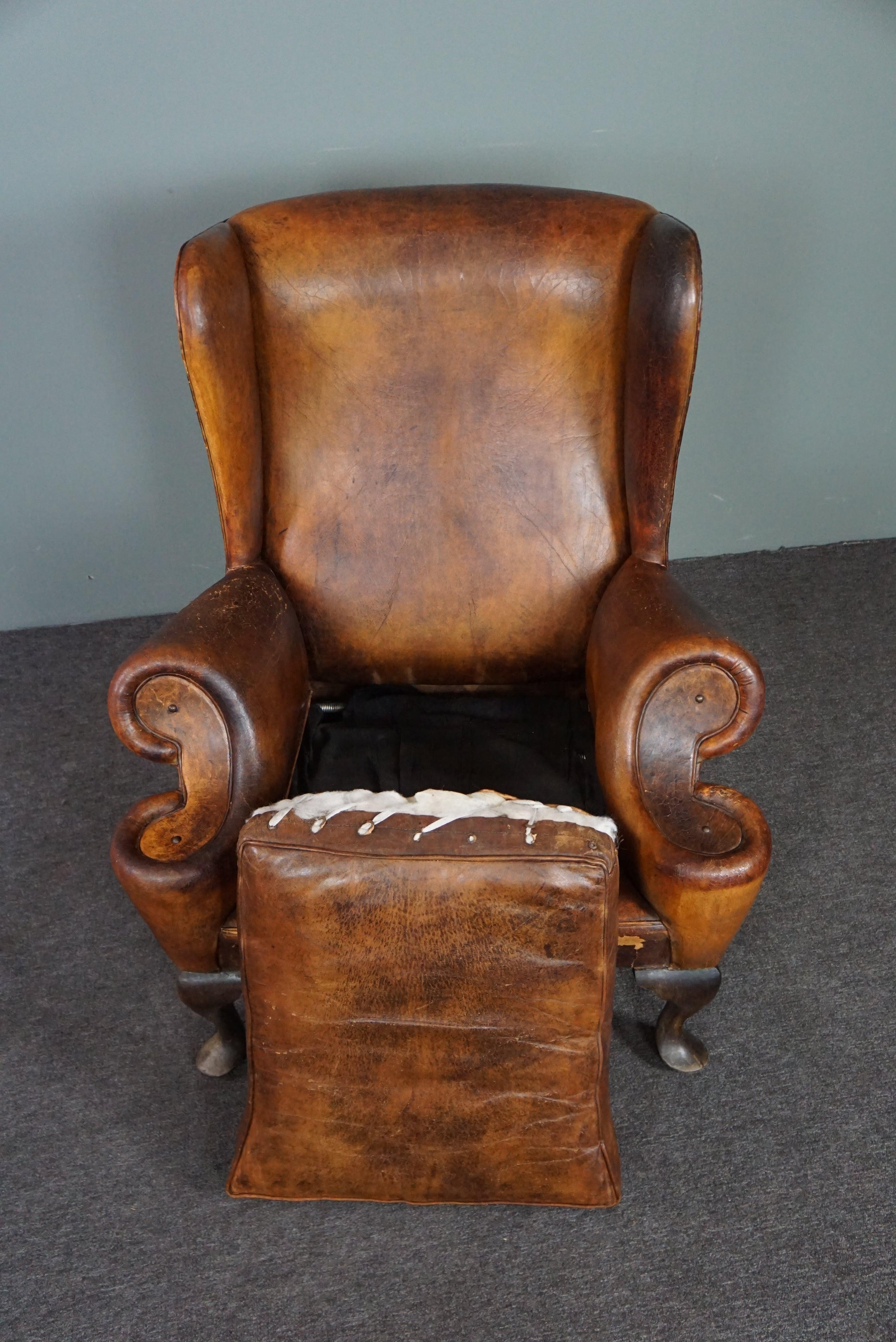 Leather Patinated sheepskin antique Wingback wingback armchair For Sale