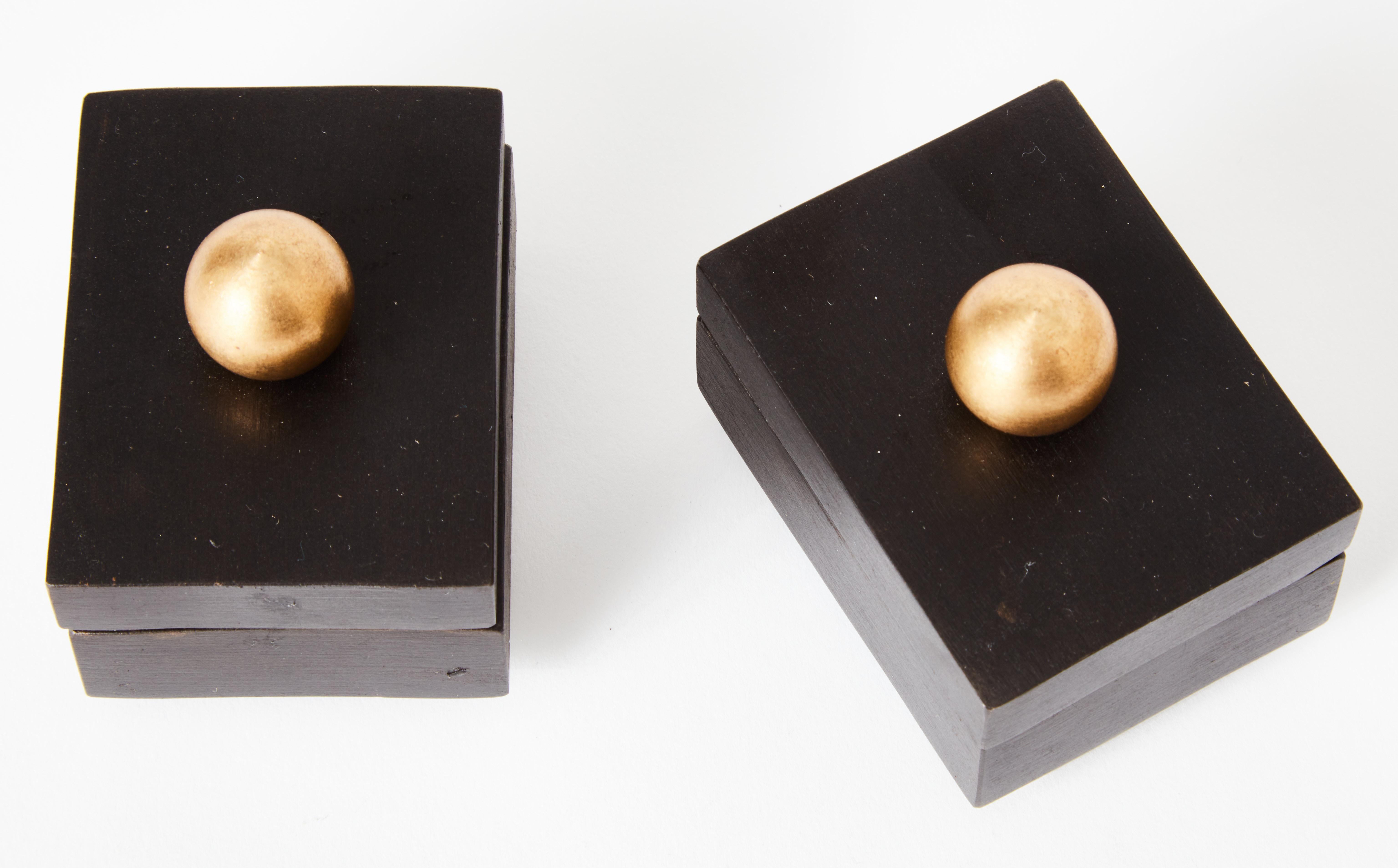 Set of 6 brass dice in a felt-lined steel box - with brass topped lid and feet.

The steel and brass have been oxidized prior to patinating with our unique statuary bronze formula. The whole piece is then sealed with a satin clear finish and waxed.