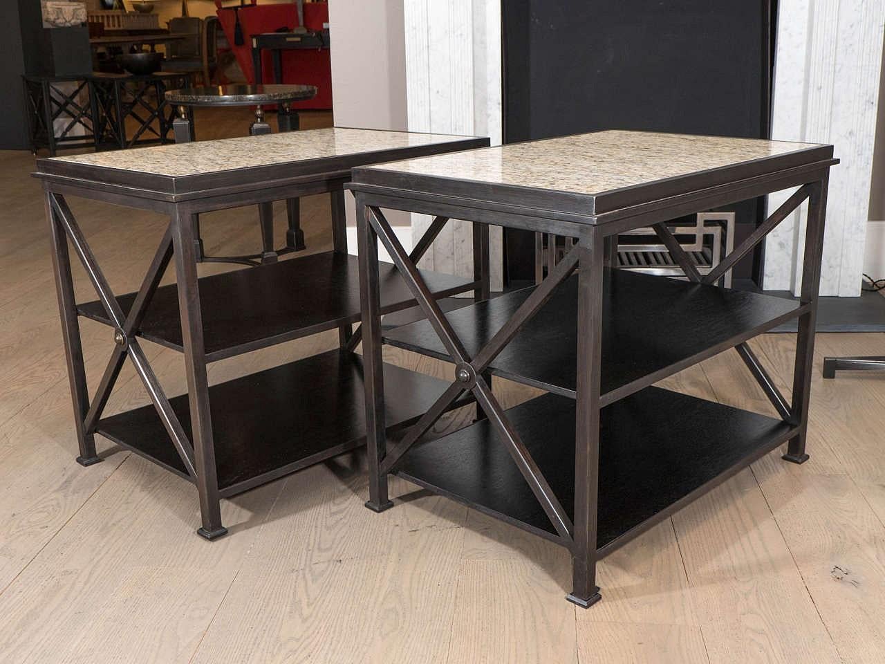 A pair of steel, rectangular 'x-form' tables with two blackened wooden shelves and inset marble tops; influenced by mid-century French neoclassical design.

The body has been oxidized prior to a statuary bronze patination using our unique formula.