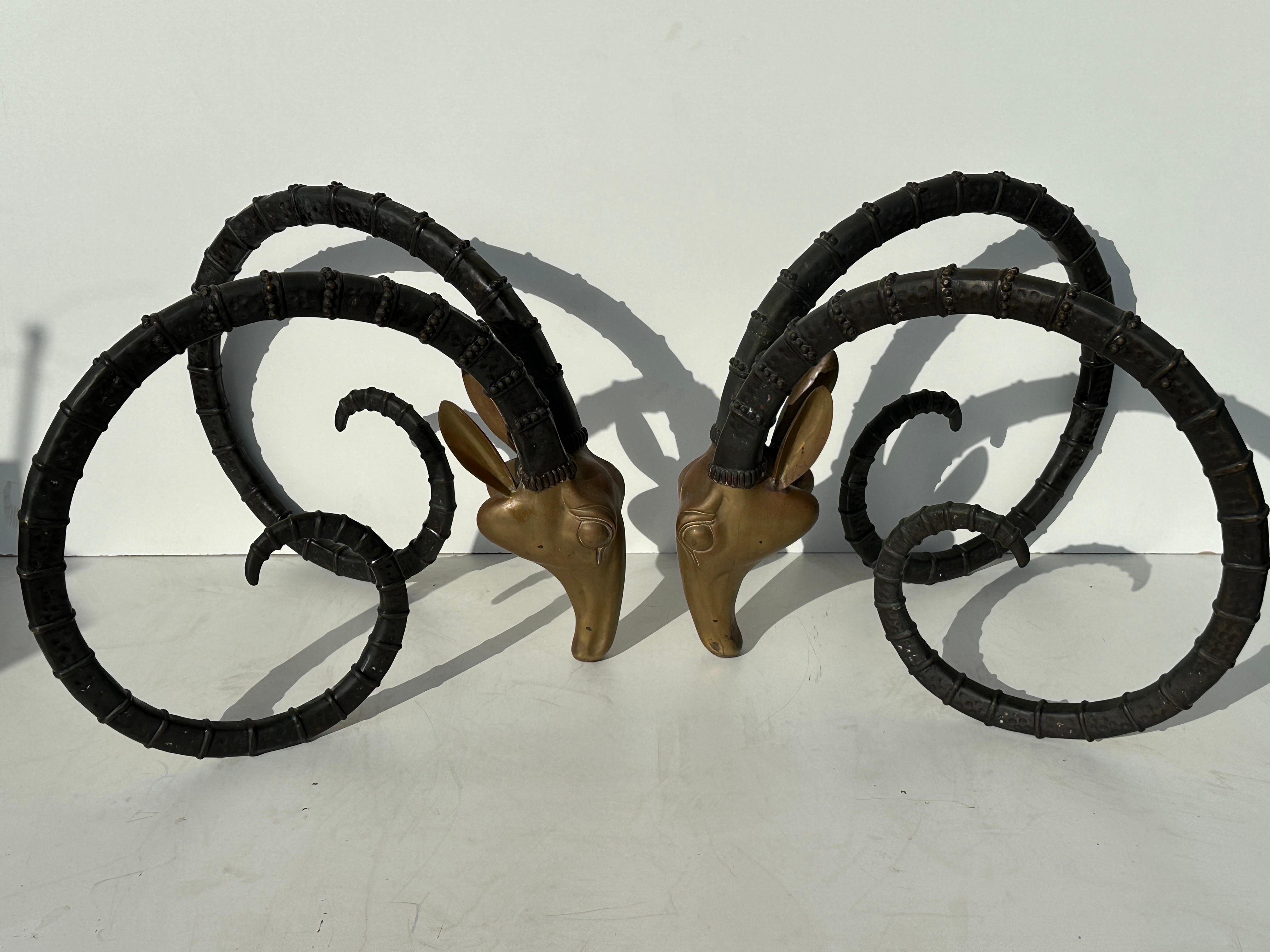 Two tone patinated brass ibex heads dining table base in the style of Alain Chervet. Each ibex is 29