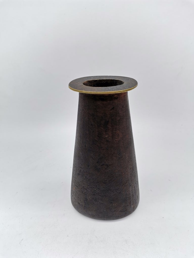 A small patinated Vase by Carl Auböck made of brass.