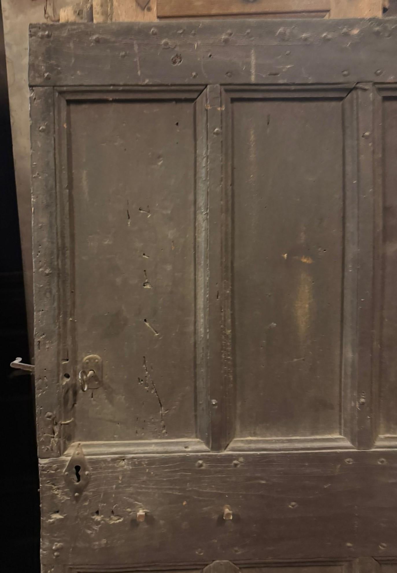 Italian Patinated wooden entrance door, main door rustic carved with panels, Italy For Sale