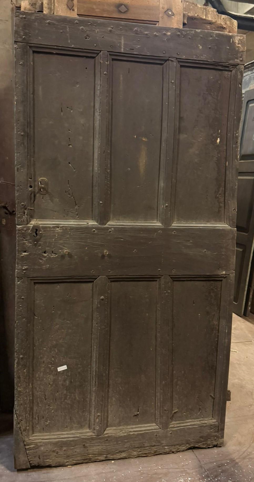 19th Century Patinated wooden entrance door, main door rustic carved with panels, Italy For Sale