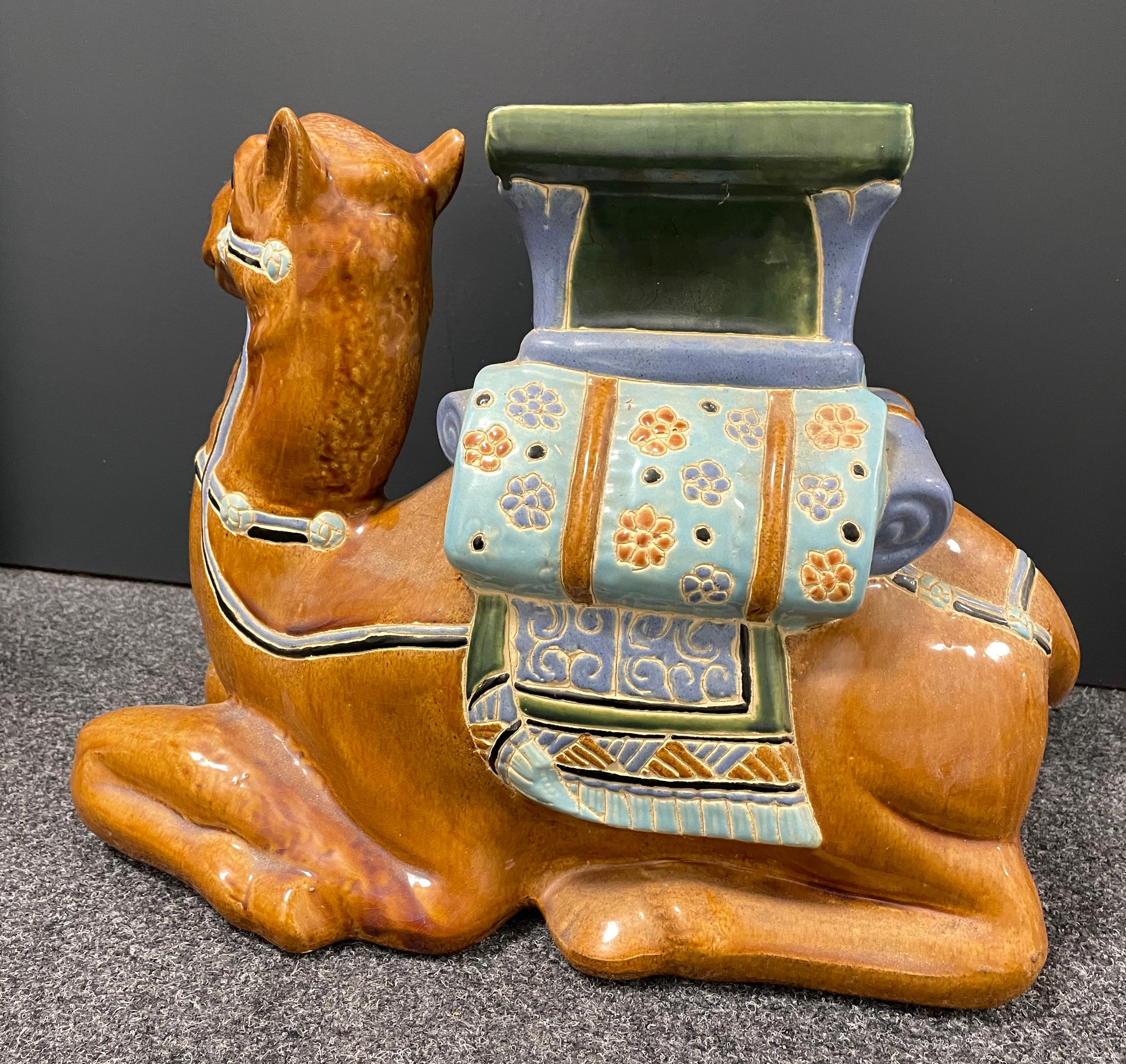 Mid-20th century glazed ceramic camel garden stool, flower pot seat, Pool Decoration or side table. Handcrafted ceramic. Nice addition to your home, patio or garden area.
   