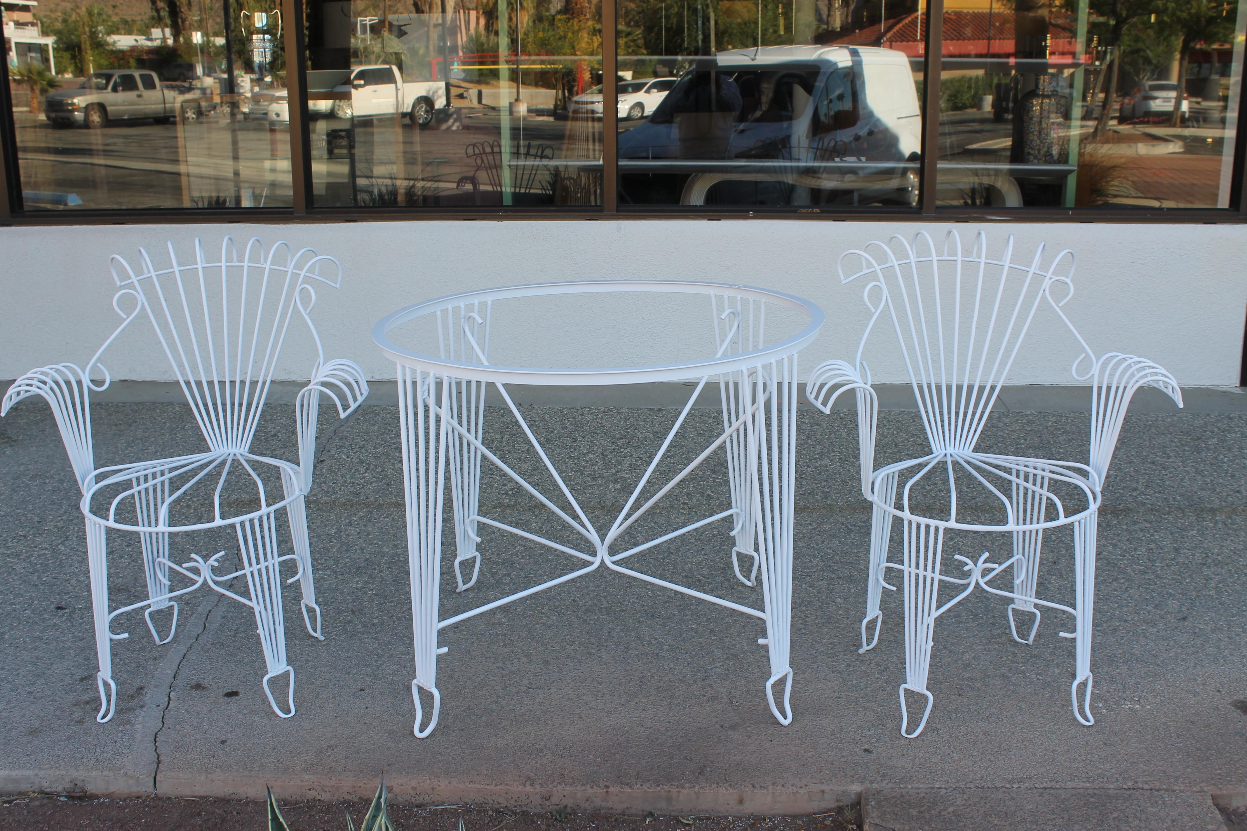 Whimsical patio set consisting of 6 chairs and table with glass top (not shown). Chairs measure 28