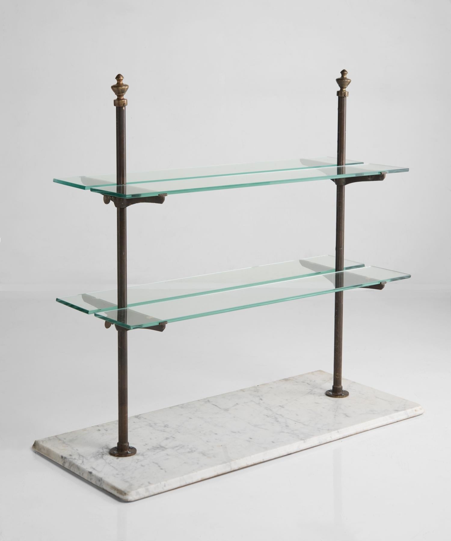 Patisserie shelving display, France, 19th century.

A unique and elegant form with marble base, brass supports and glass shelves.