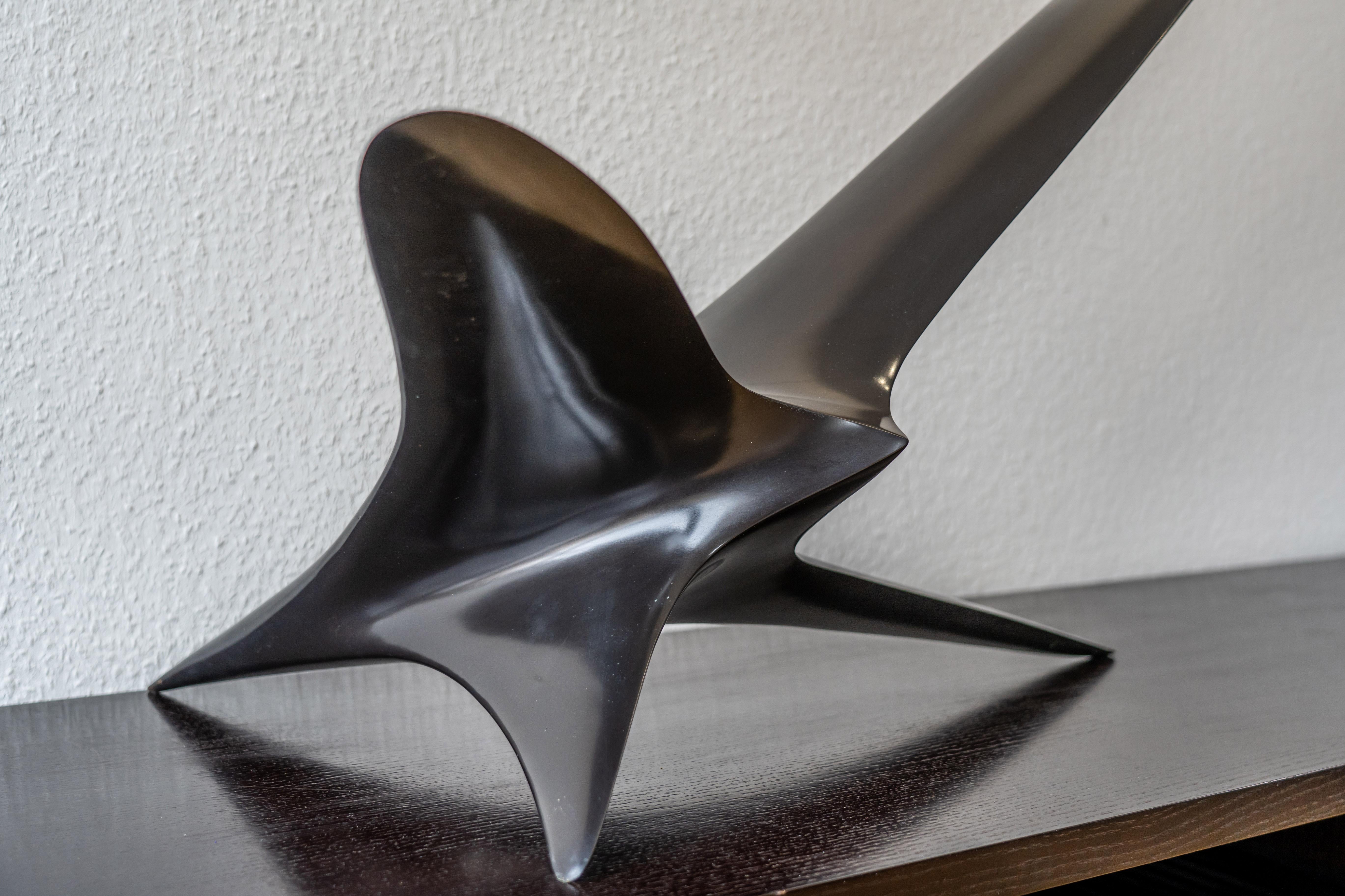 Twin Bird is an abstract bronze sculpture with a black patina, made by Patrice Breteau, a French contemporary artist. This bronze sculpture Twin Bird; refers to the two angles the bird can be seen either pecking or flying away.

Breteau’s works