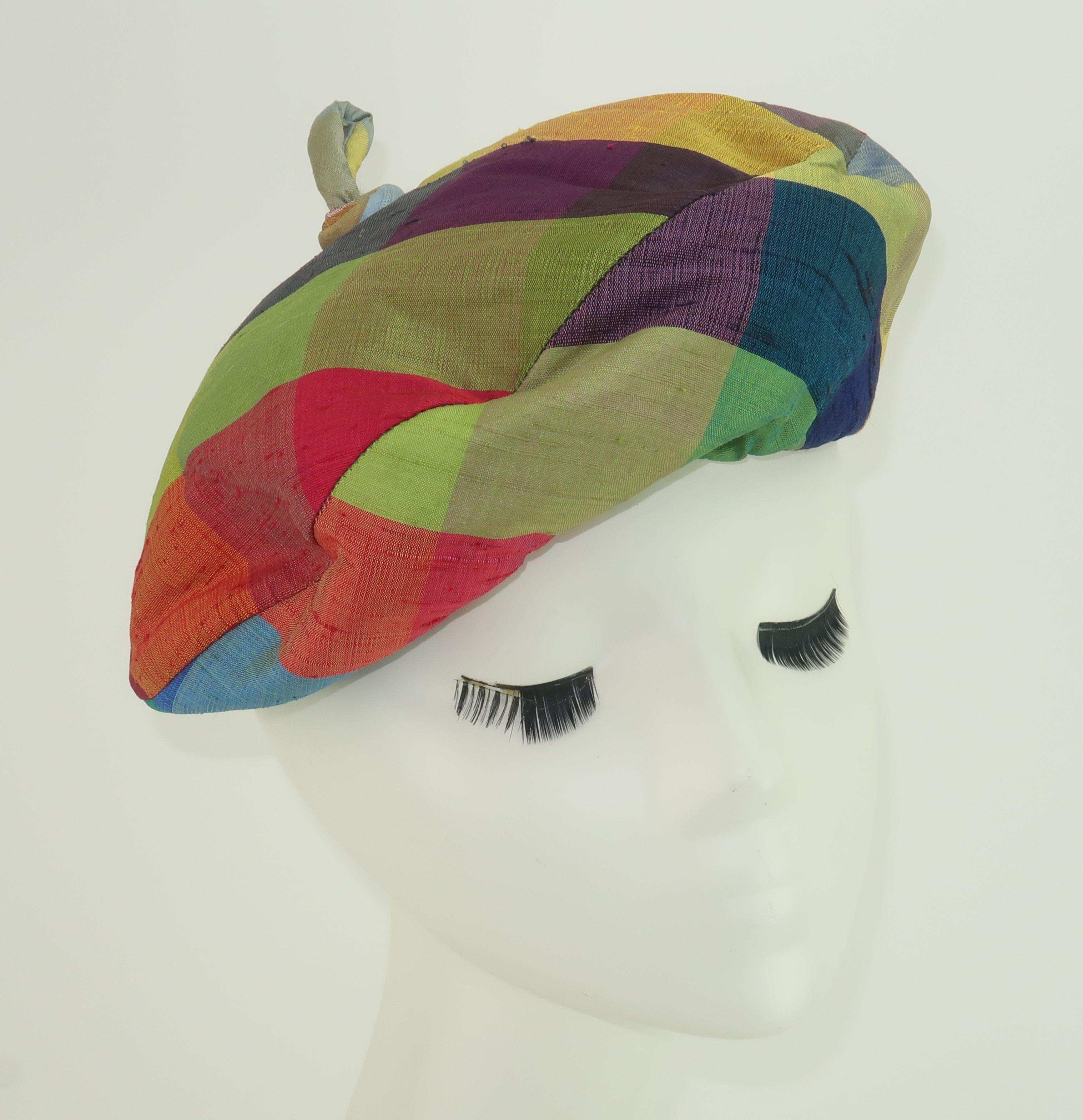 C.1960 Patrice silk madras hat with a beret silhouette in jewel tone colors including blue, fuchsia, yellow, olive green, purple, red and orange.  The swirled finial is the cherry on top!  Padded for shape and lined in gray silk faille fabric with