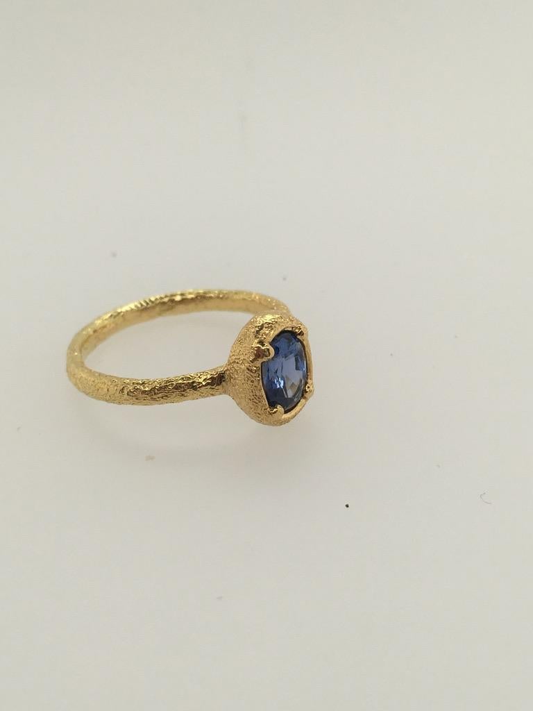 Oval Cut PATRICIA DAUNIS Ceylon Blue Sapphire Set in Hand-textured Gold Atuik Ring  For Sale
