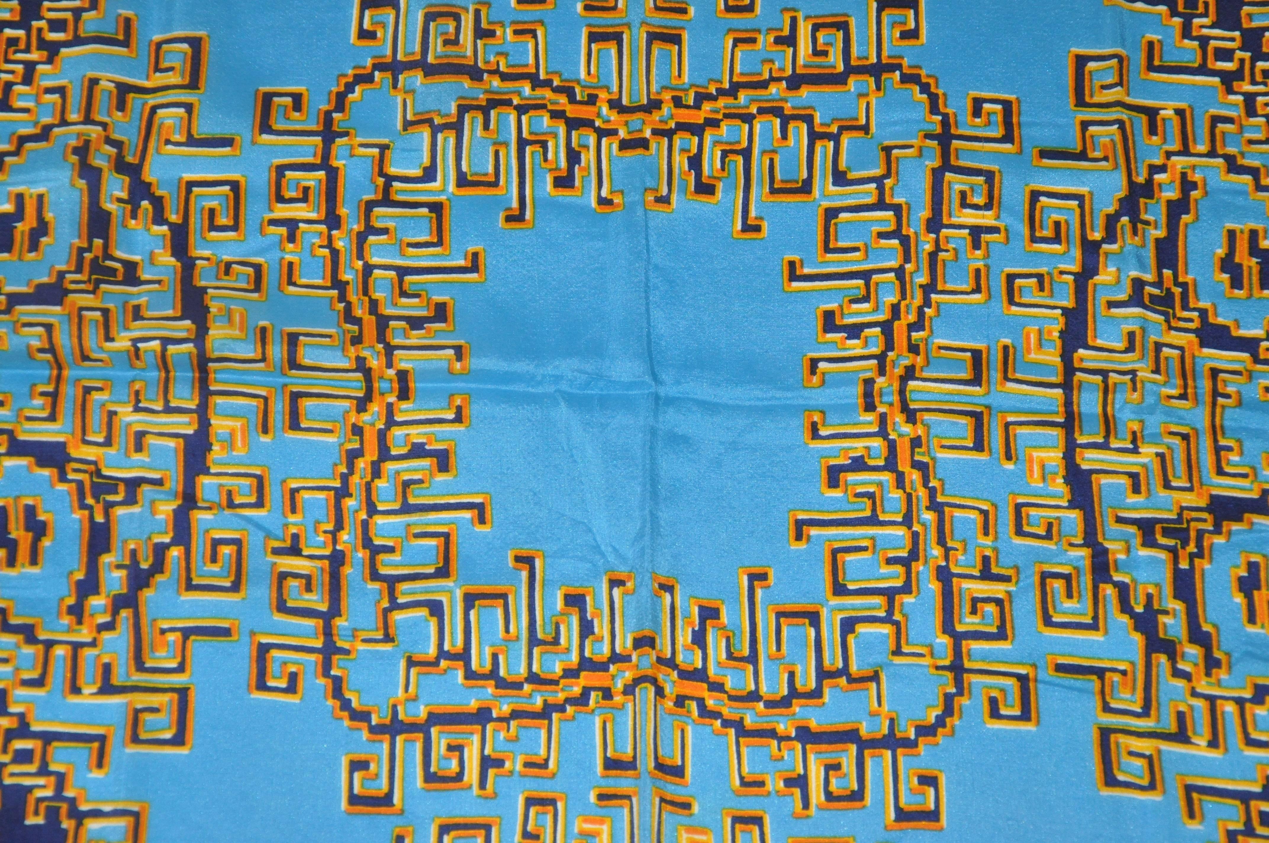        Patricia Duval wonderful silk crepe di chine scarfs of multi shades of blues, tangerine & yellow is detailed with hand-rolled white edges. Scarf measures 30 inches by 28 inches, and made in France.