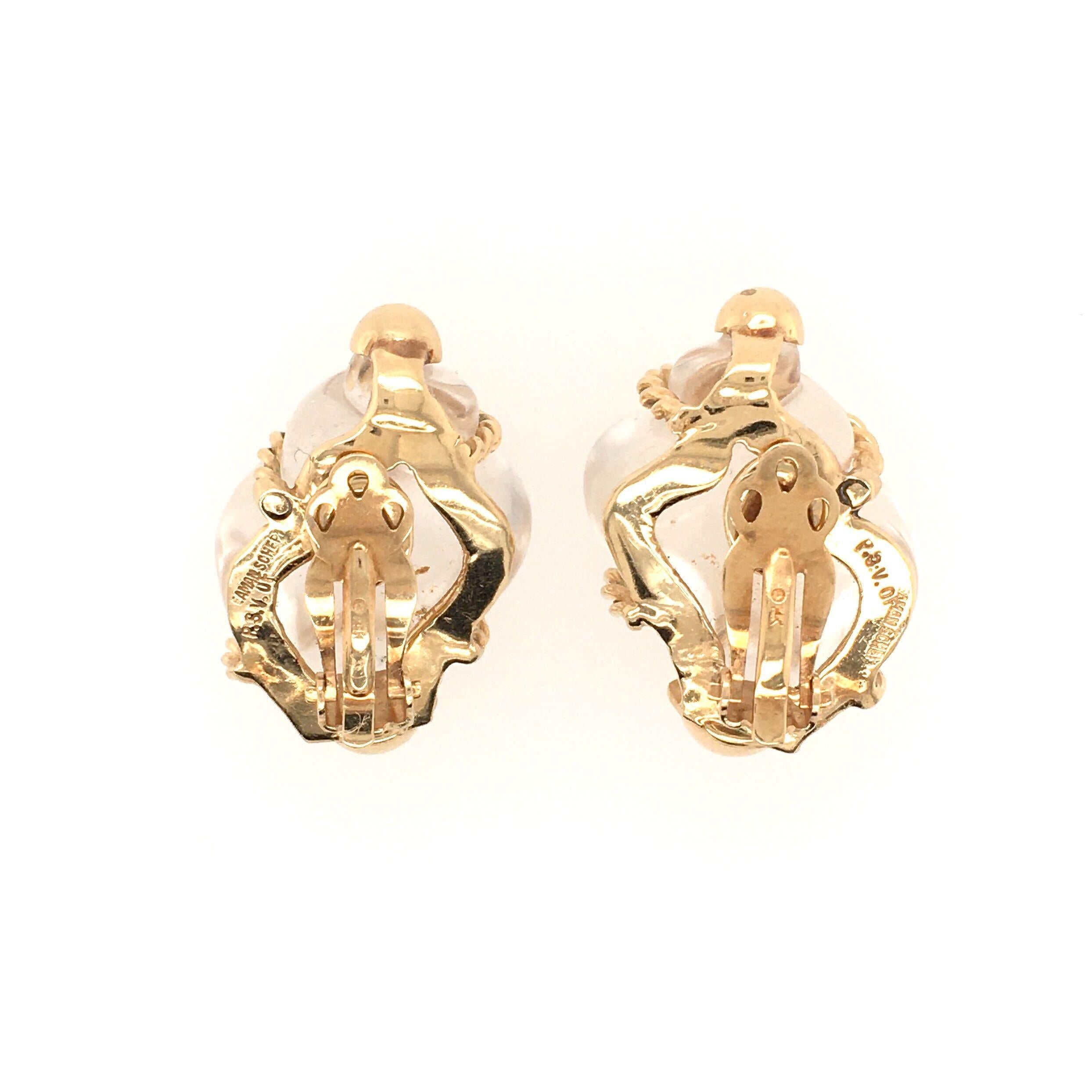 A pair 14 karat yellow gold and rock crystal earrings. Patricia Schepps Vaill for Seaman Schepps. Circa 1980. Each set with a carved rock crystal shell, wrapped in yellow gold rope work. Length is approximately 1 1/4 inches, gross weight is