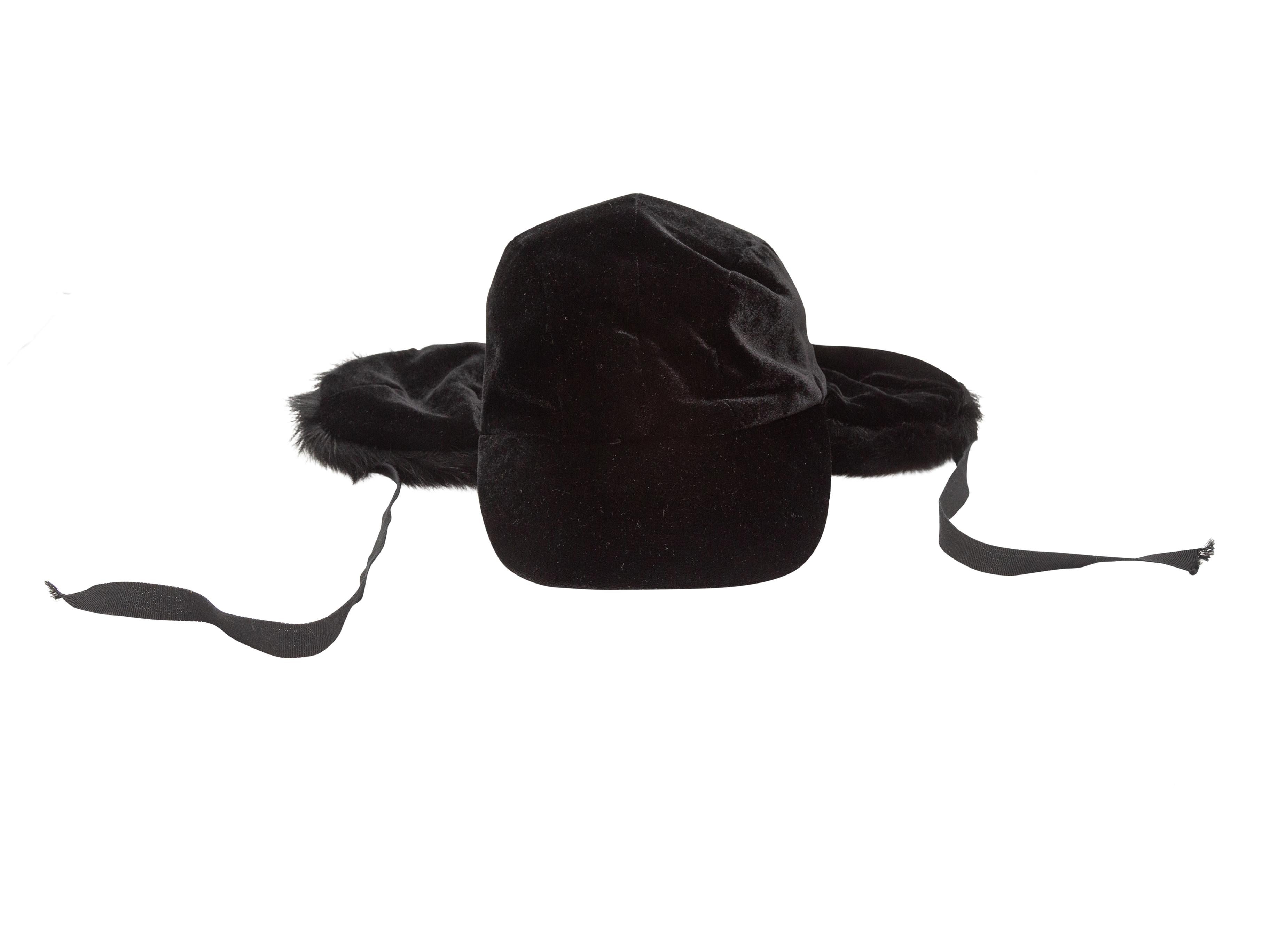Product Details: Black velvet baseball cap with fur ear flaps by Patricia Underwood. 3.5
