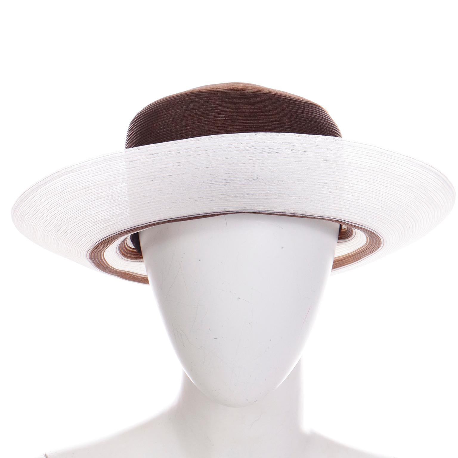 We love vintage Patricia Underwood hats and this one is really fun and easy to wear. The crown of the hat is brown and the brim is white with brown stripes. The hat is made of a coated mesh and is a perfect hat to add to your summer wardrobe!