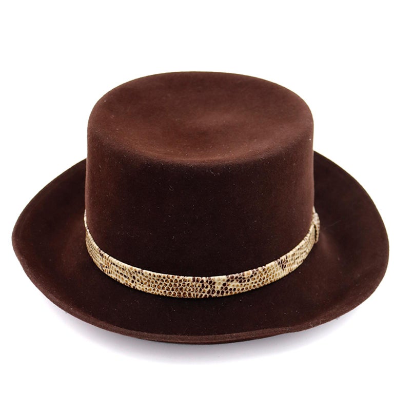 This is a beautiful vintage Patricia Underwood dark brown wool hat with a narrow snakeskin band. Patricia Underwood hats are some of the most beautiful and they are so well made. 
INNER MEASUREMENT: 22