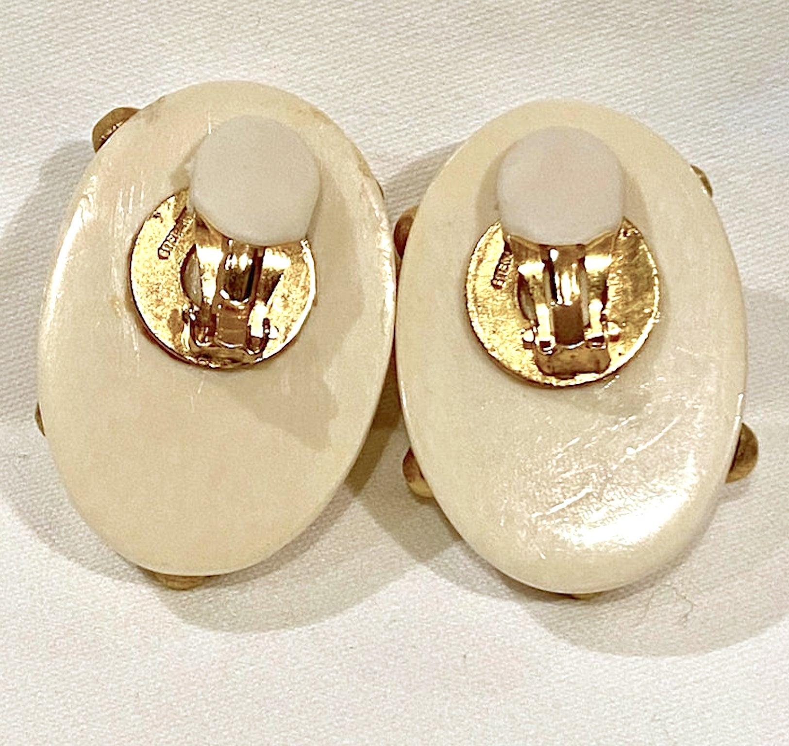 A stunning pair of late 1970s to early 1980s Patricia Von Musulim earring in bone with gold on sterling silver vermeil studs. Each oval dome earrings has a clip back and measures 1.25 inches wide, 1.75 inches tall and .75 of an inch high not