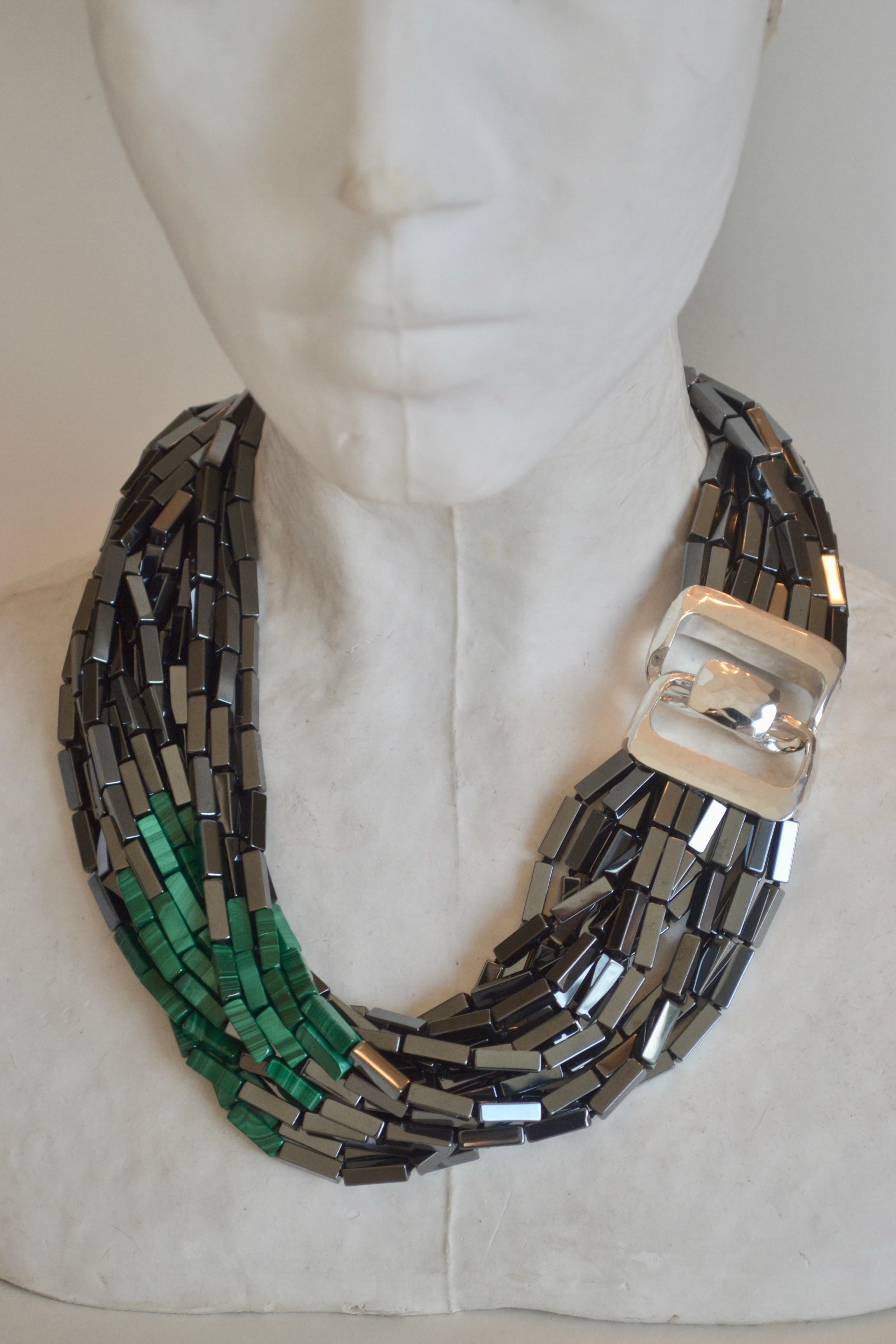 Sterling silver clasp with hematite and two side panels of green malachite (14 strands) from Patricia von Musulin. 
